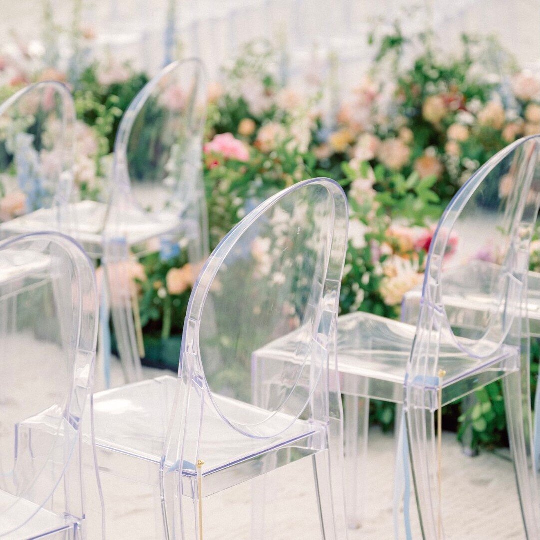 Ghost chairs can be a solution when you have a busy or cluttered backdrop or a soft beautiful scene that you don&rsquo;t want to distract from.  They are also a great way to mimic the water in this case. Creating fluidity in a space where chairs just