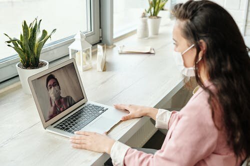 Stock Photo 1: A patient receives care through a telehealth visit. Source: https://www.pexels.com/photo/people-on-a-video-call-4225920/
