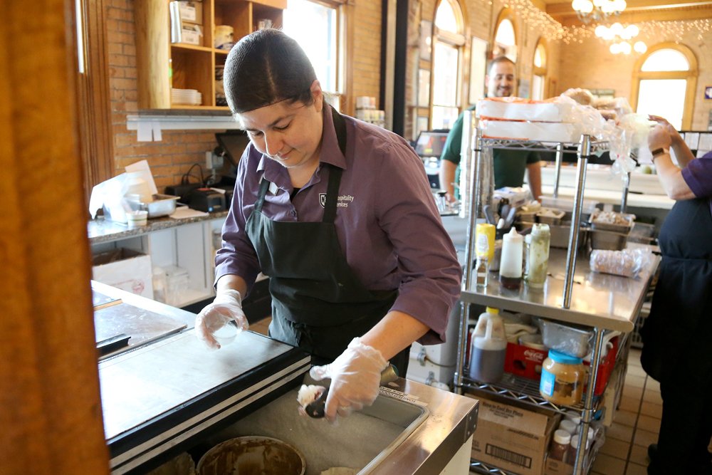  UNH Dairy Bar retail associate Diana Guy scoops ice cream on Tuesday, June 14, 2022 in Durham. Olivia Falcigno/Seacoastonline 