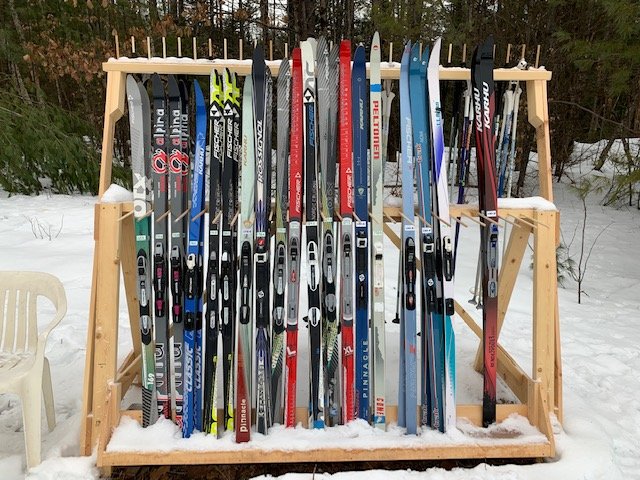  Pine Hill Ski Club offers a variety of skis, boots, and poles for skiers of all ages. by Linda Magoon 
