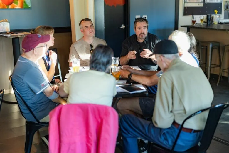  Members of the public speak with Monitor reporter David Brooks during the Publisher’s Crawl at Lithermans Limited Brewing Company on June 9, 2026 in Concord. Credit: ALEX MILLER / For the Monitor 