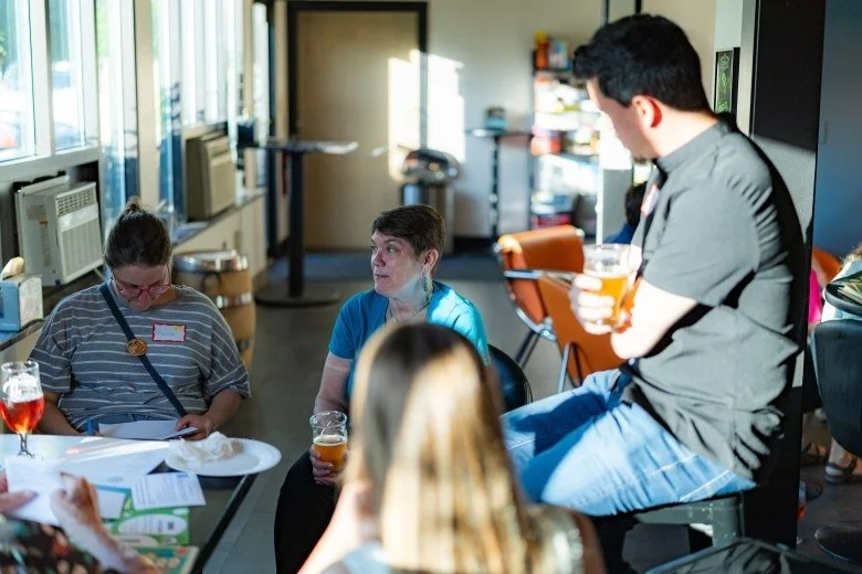  Members of the public participate in a small group discussion during the Publisher’s Crawl at Lithermans Limited Brewing Company on June 9, 2026 in Concord. Credit: ALEX MILLER / For the Monitor 