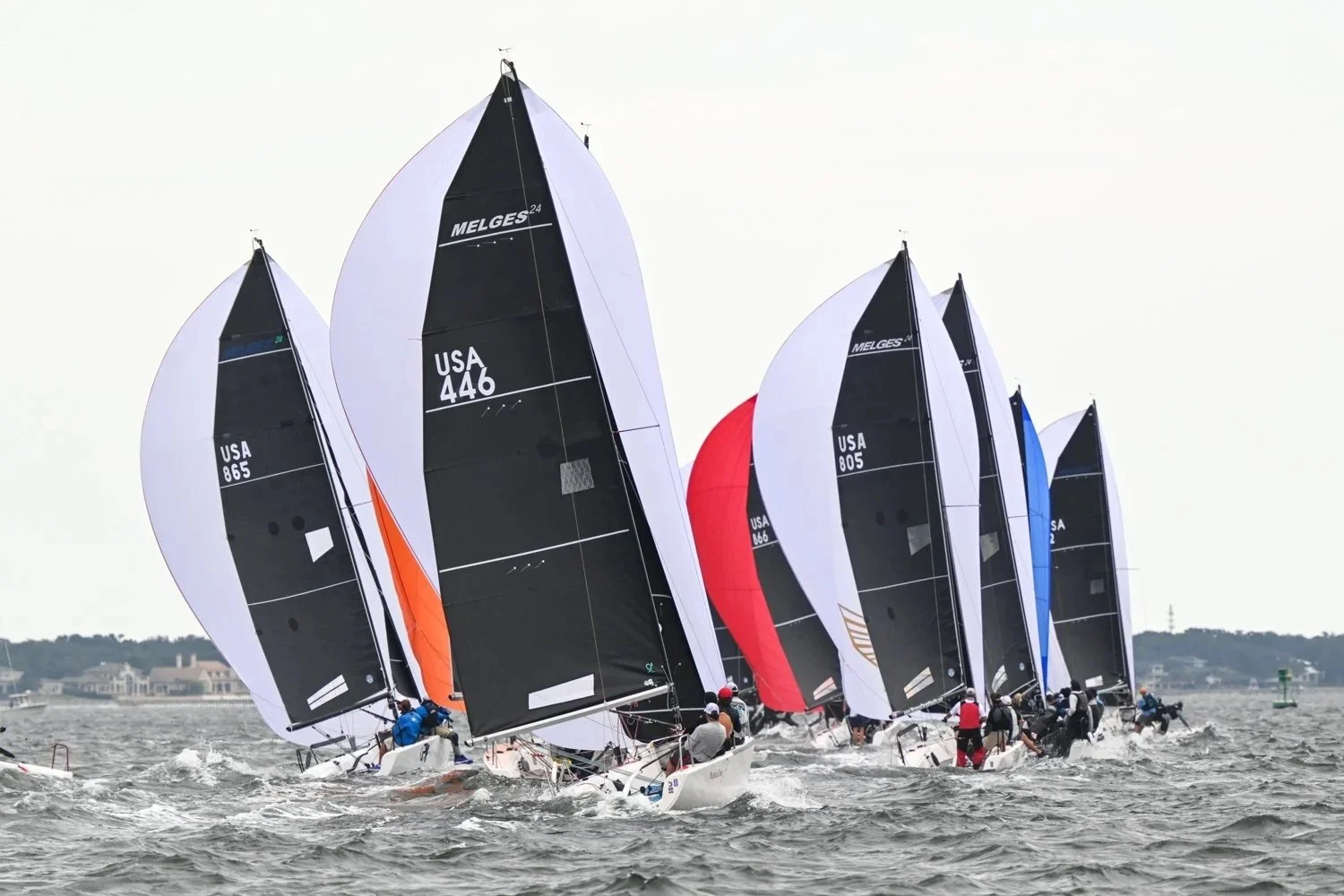 Melges 24 Fleet races downwind on a cloudy day on Pensacola Bay