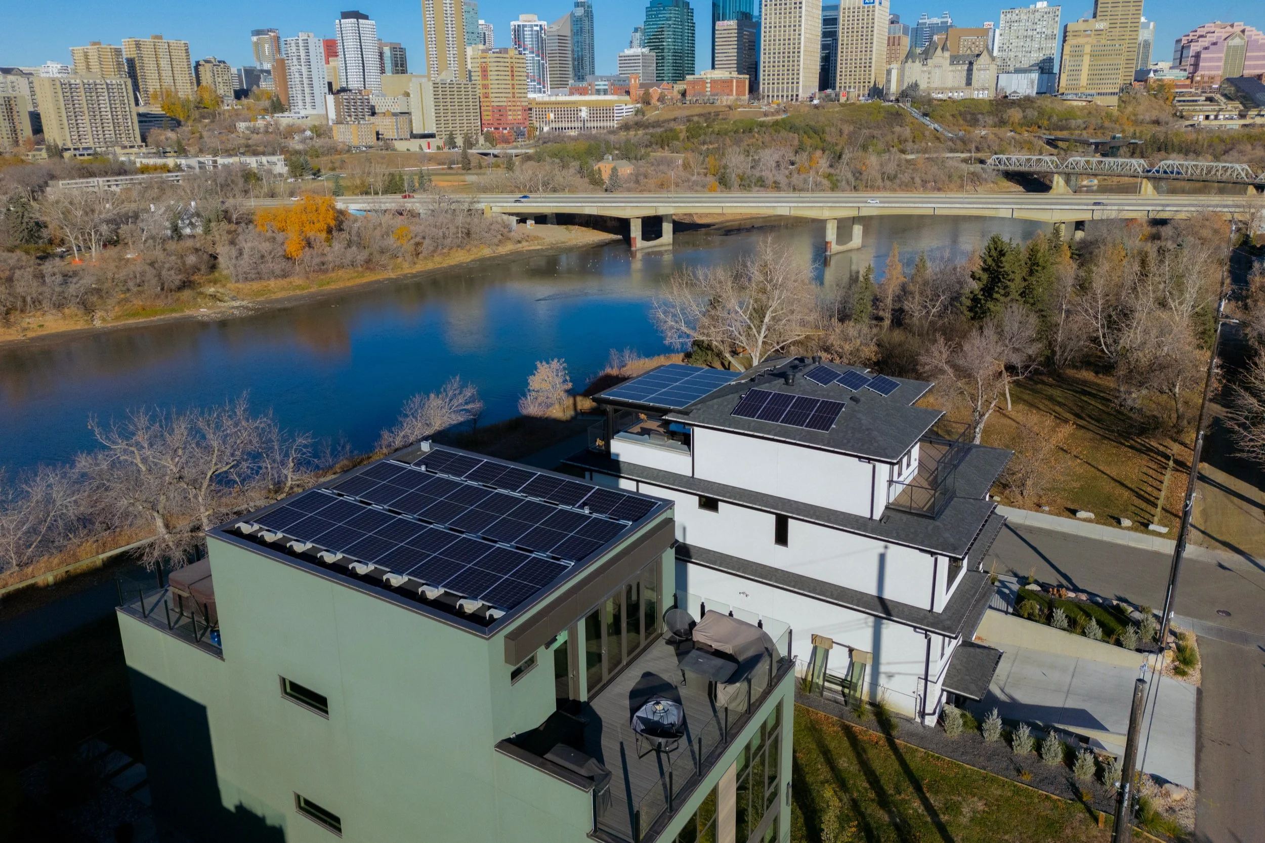 The roof of two houses with solar panels