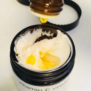 TNB ccream pouring calendula oil.jpg
