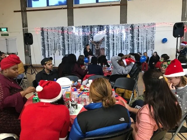 Students listen to Sophie Dempsey from Marketing and Event Management class singing at the Christmas Party