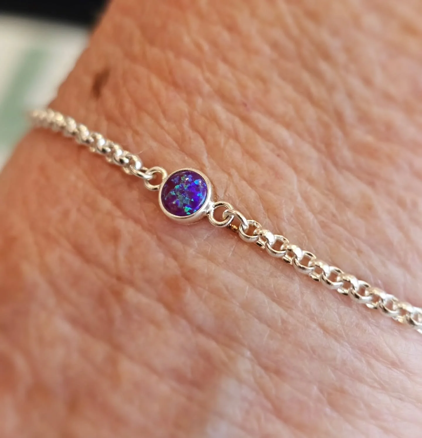 Wow! The dark opal connector charm is absolutely stunning..... shinning between rich purples &amp; greens 💜💚 permanently attached to the  heavier weight, sterling silver belcher bracelet! Love It! Thank ~You xXx