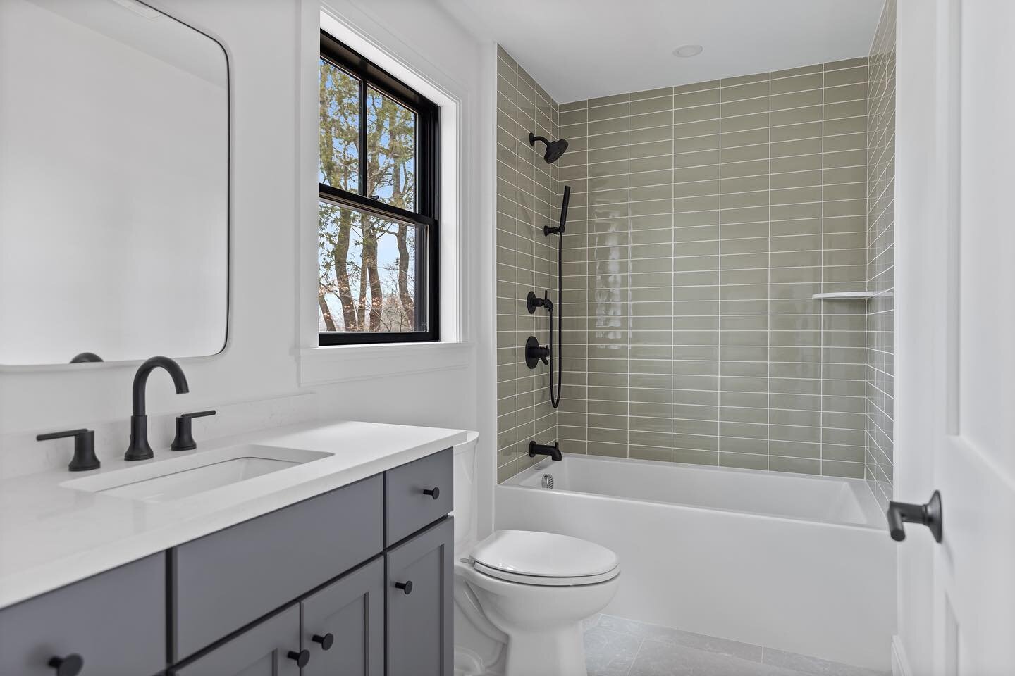 Guest suite bathroom at Nine Battle Green project. @cb_interiors_ nailed it with these calming tones and stacked tile layout.