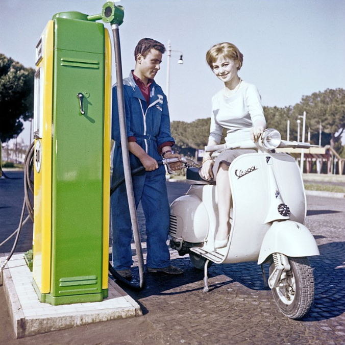 Italian actress Alessandra Panaro on her Vespa at a gas station, photo by Pierluigi Praturlon, Rome, 1957