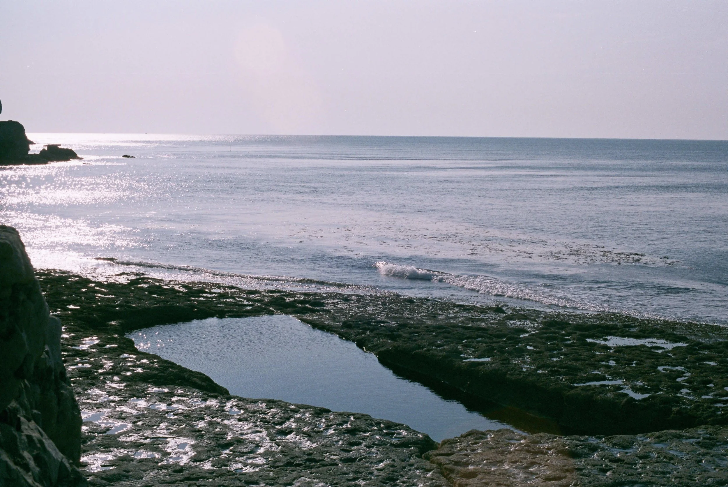 Approximately 100 years ago a local headmaster asked the blasters to blast a pool out of the ledge for his schoolchildren (the cart tracks and iron rings along with giant amonites still visible on the ledge); the resulting chasm filling and refreshing with each incoming tide - an amazing place to swim all to yourself, if you arrive early morning/early evening to avoid the other visitors..