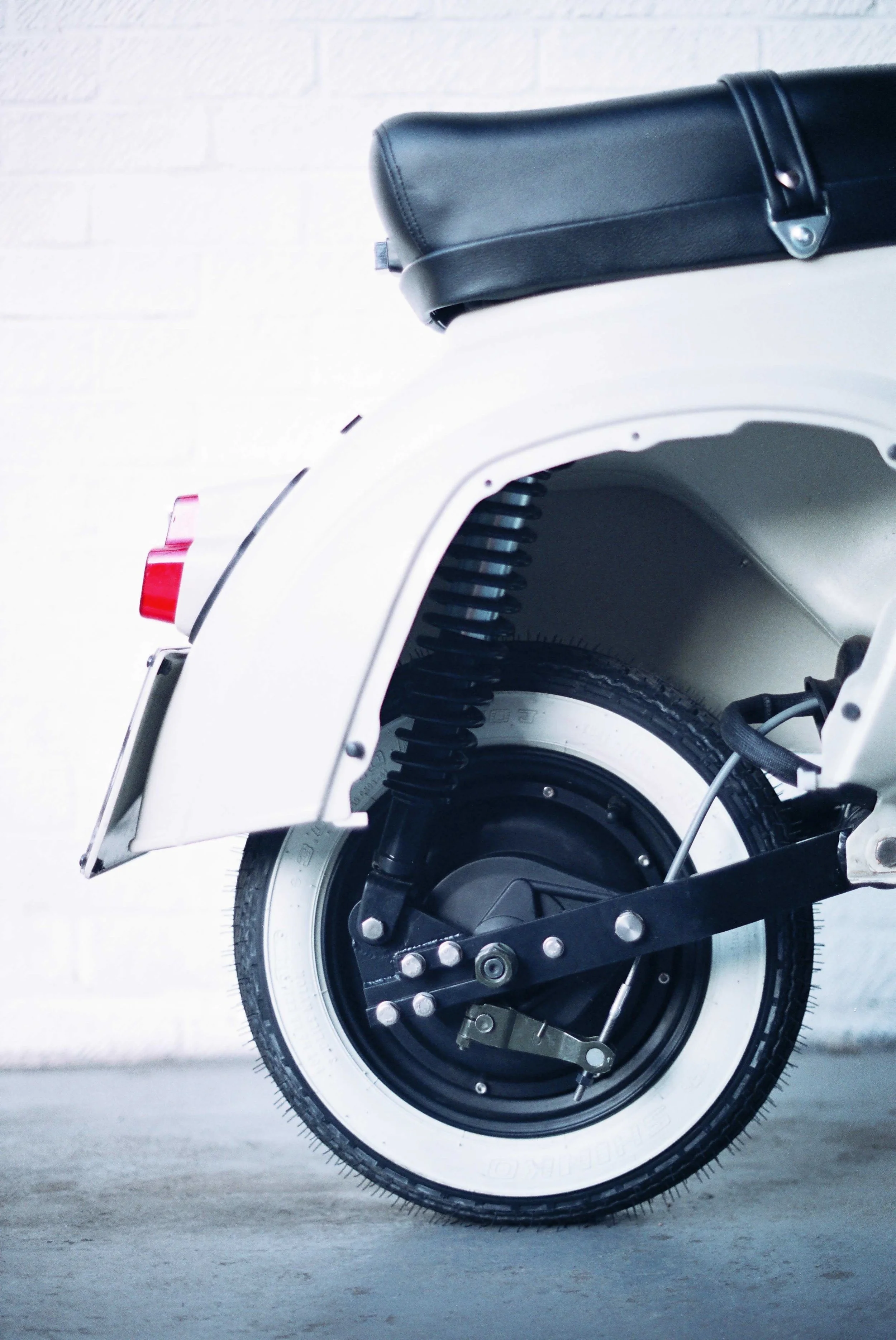Space left by engine on smallframe Vespa is not large enough to accommodate an additional battery pack (surplus to underseat battery) - however the vacant engine bay on a large frame Vespa can fit another battery pack. Toolbox spaces could also be used for extra battery allowing increased range.