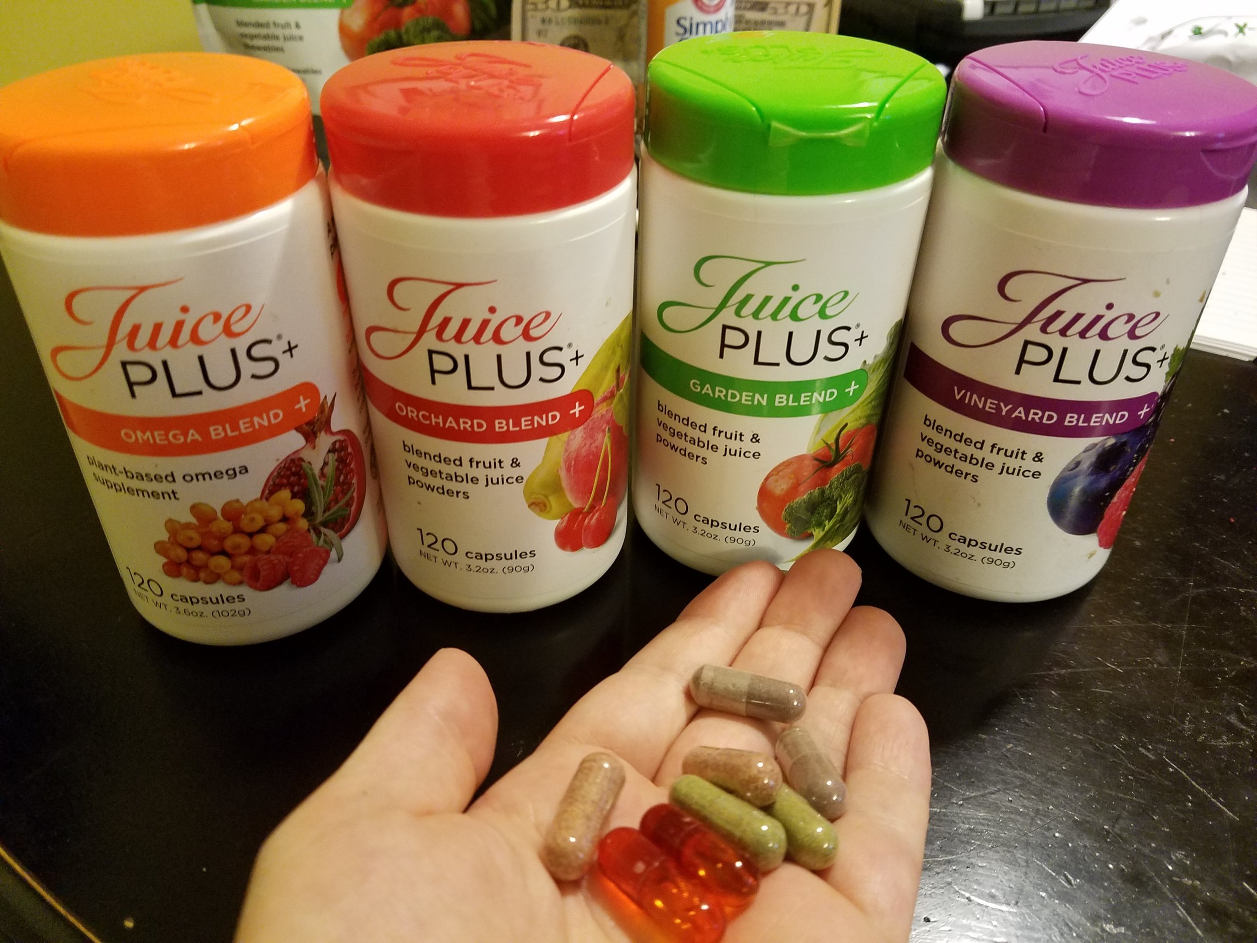 capsules in hand.jpg