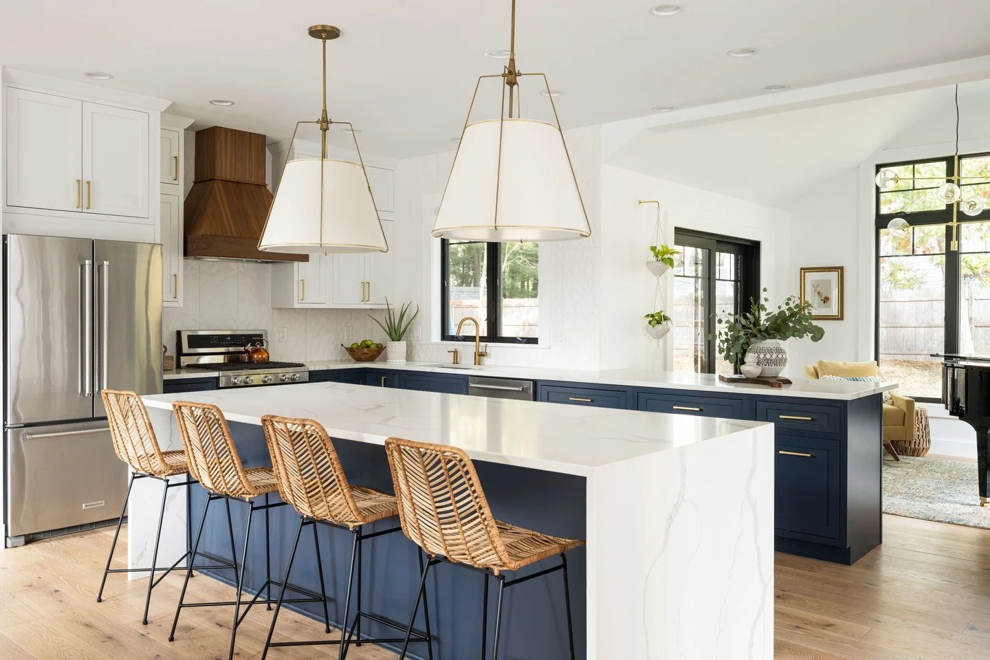 Blue, bright and beautifully reimagined 💙. Would you believe that this was once a tiny closed of raised-ranch kitchen?  What is your favorite part of this renovation?  Personally, I still swoon over the walnut vent hood.  #copperdotinteriors #kitche