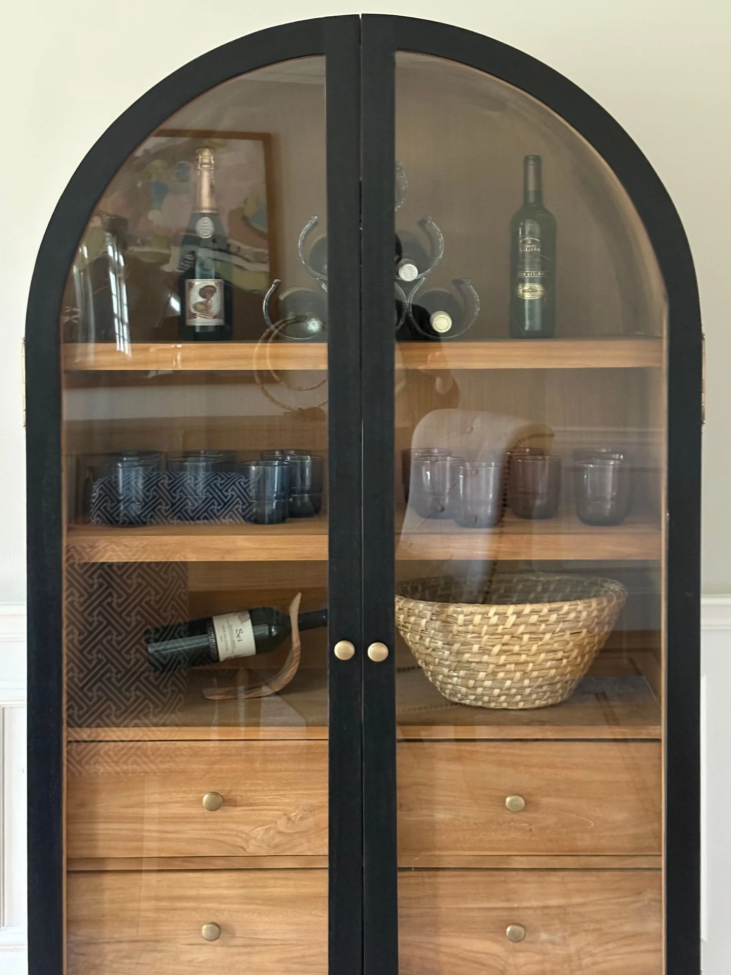 A stylish cabinet that shows off your pretty drinkware, stores your dining necessities, and of course has your drink of choice ready to pour...is always a good idea.  Cheers to a new year!🥂. #copperdotinteriors