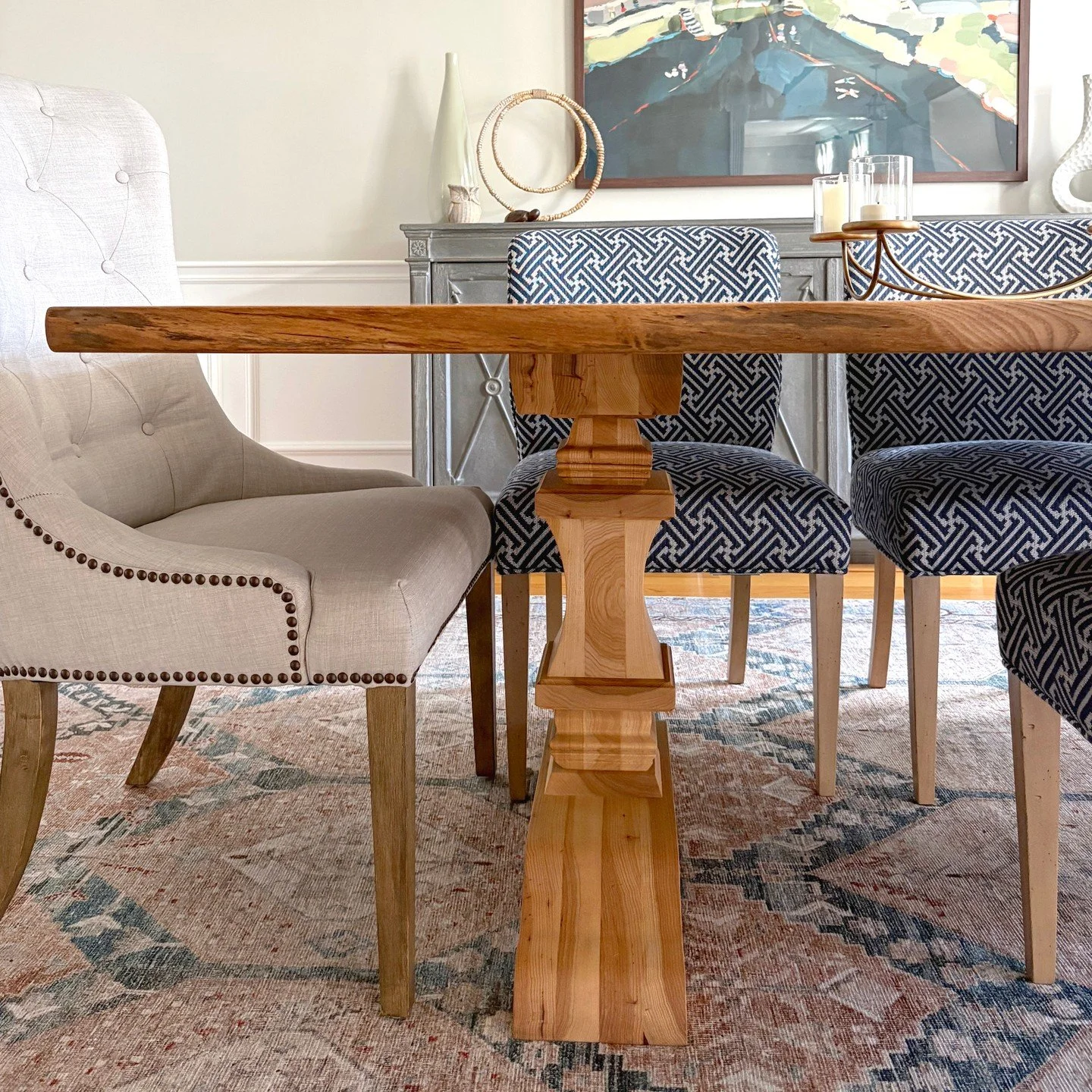 Sometimes the perfect piece for a space is something you create.  For this formal dining room, our clients selected a stunning slab and collaborated with a local carpenter to transform it into a one of a kind live edge table.  Custom carved legs with