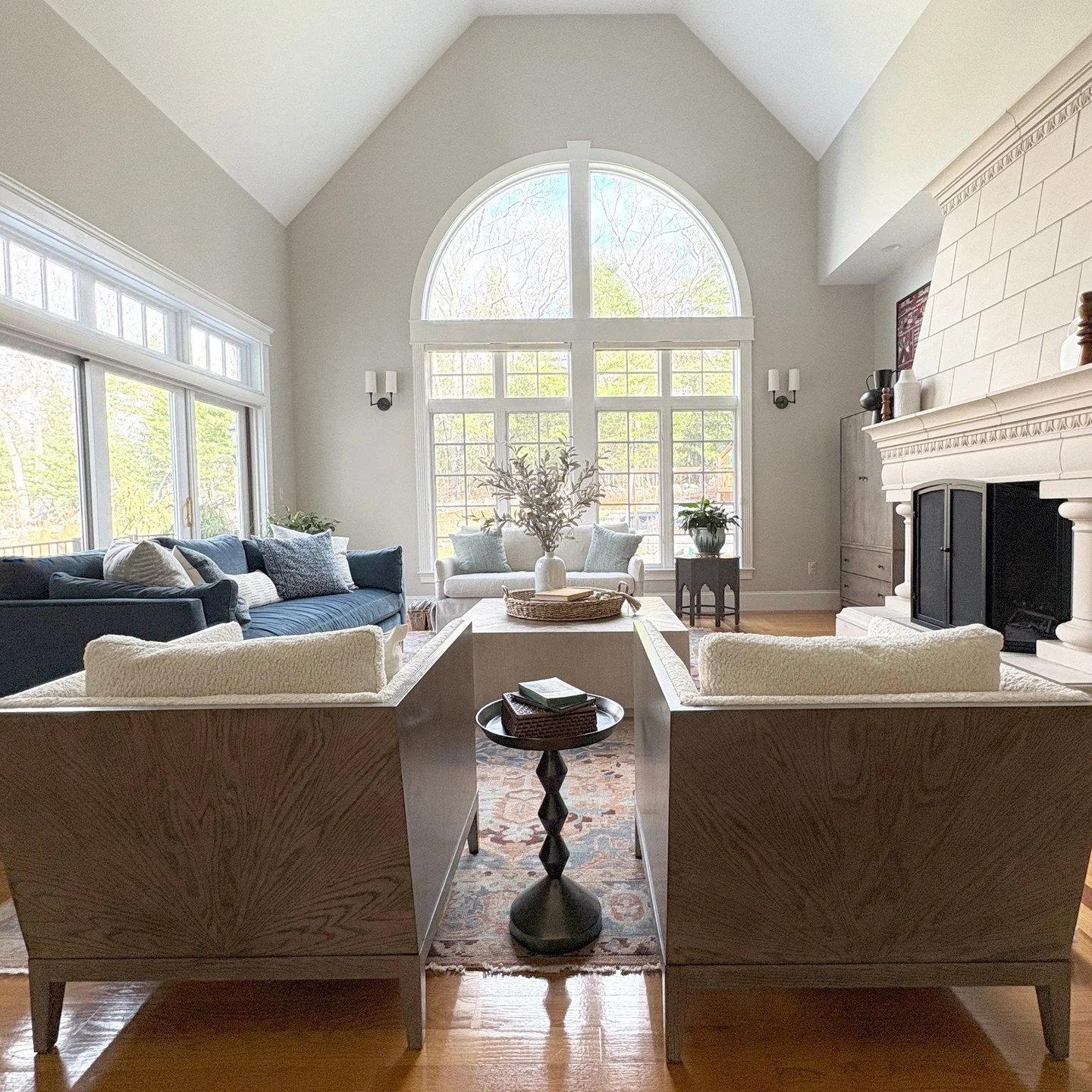 Clean lines, soft textures, and a lot of natural light.  Sometimes the room itself makes a statement and the furnishing's job is just to enhance it.
