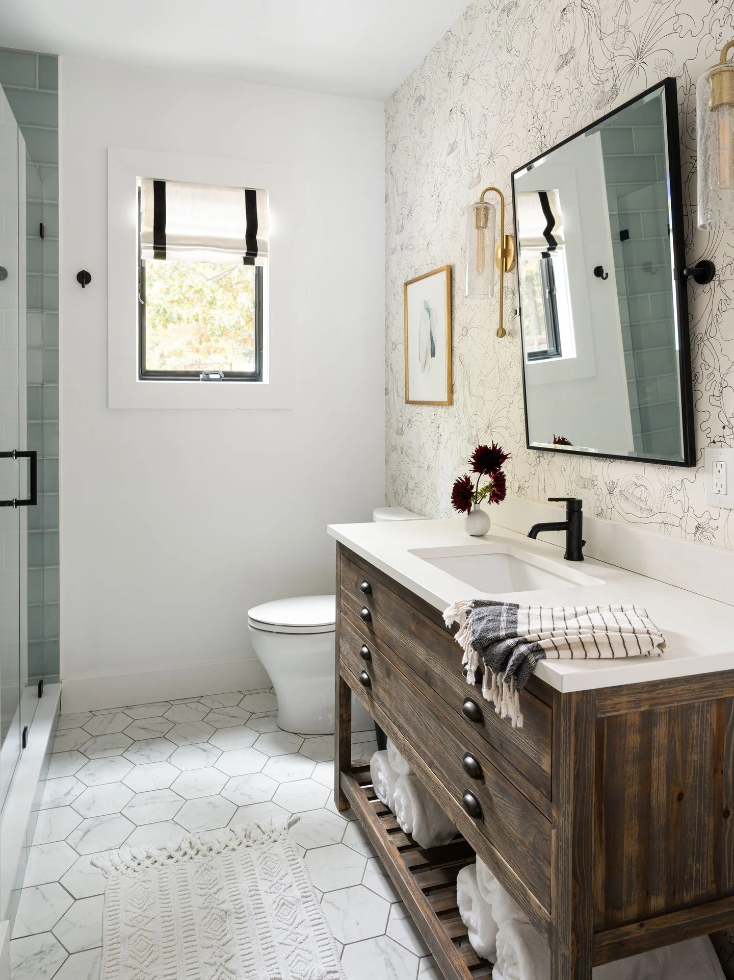 Years later this is still one of my favorite bathrooms.  Classic shapes are met with the delicate lines of this fun wallpaper.  Looks like a floral from afar, but has weird sea creatures if you look closely 🐡🐙