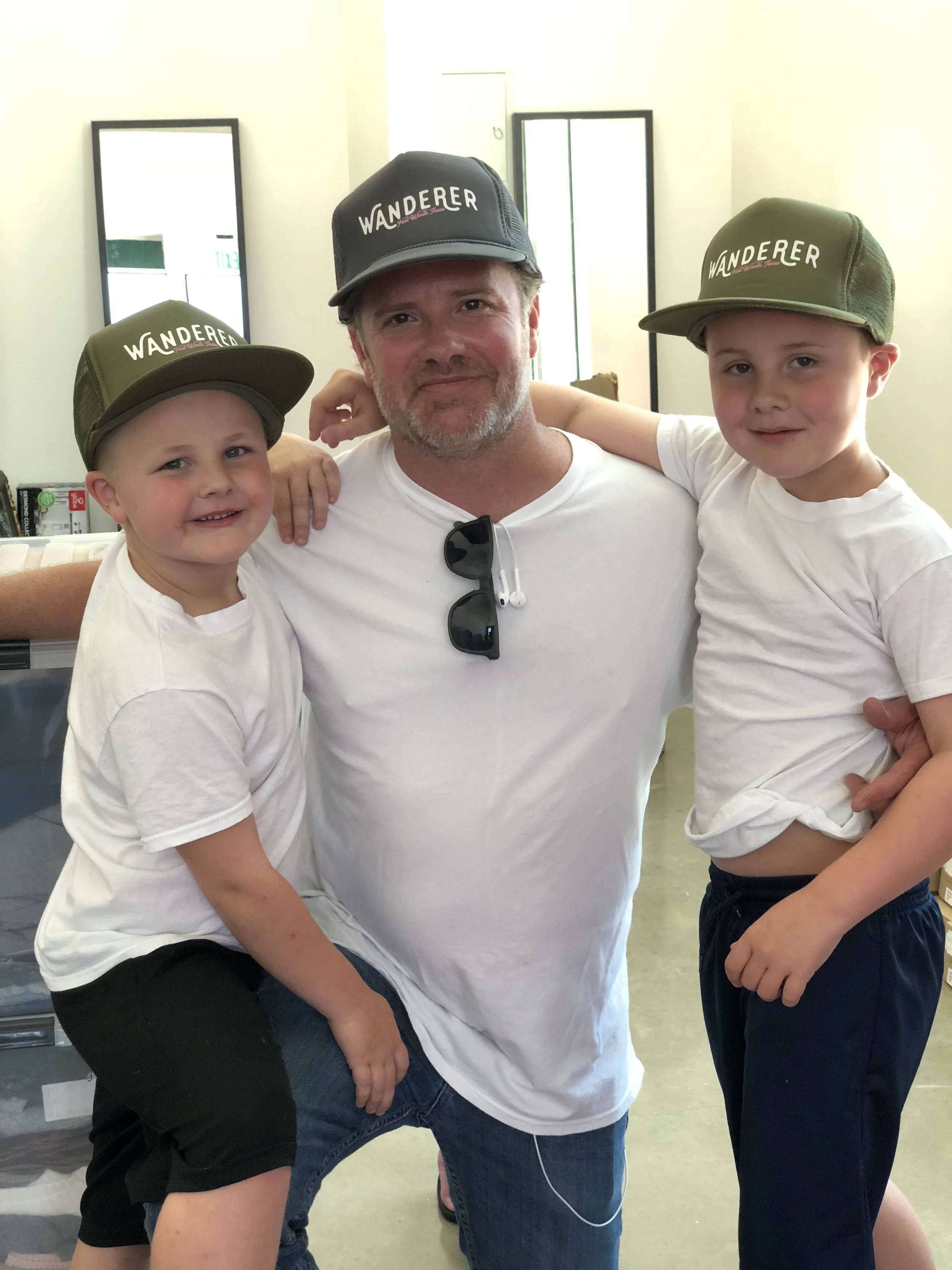 My husband and his sons repping Wanderer right before I opened my doors.
