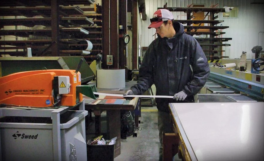 Operator in Indaco Metals’ trim shop feeds scrap into a newly installed Sweed Slitter Line Model 450SL Scrap Chopper. The unit chops material into 3-inch pieces for easier and more efficient recycling.