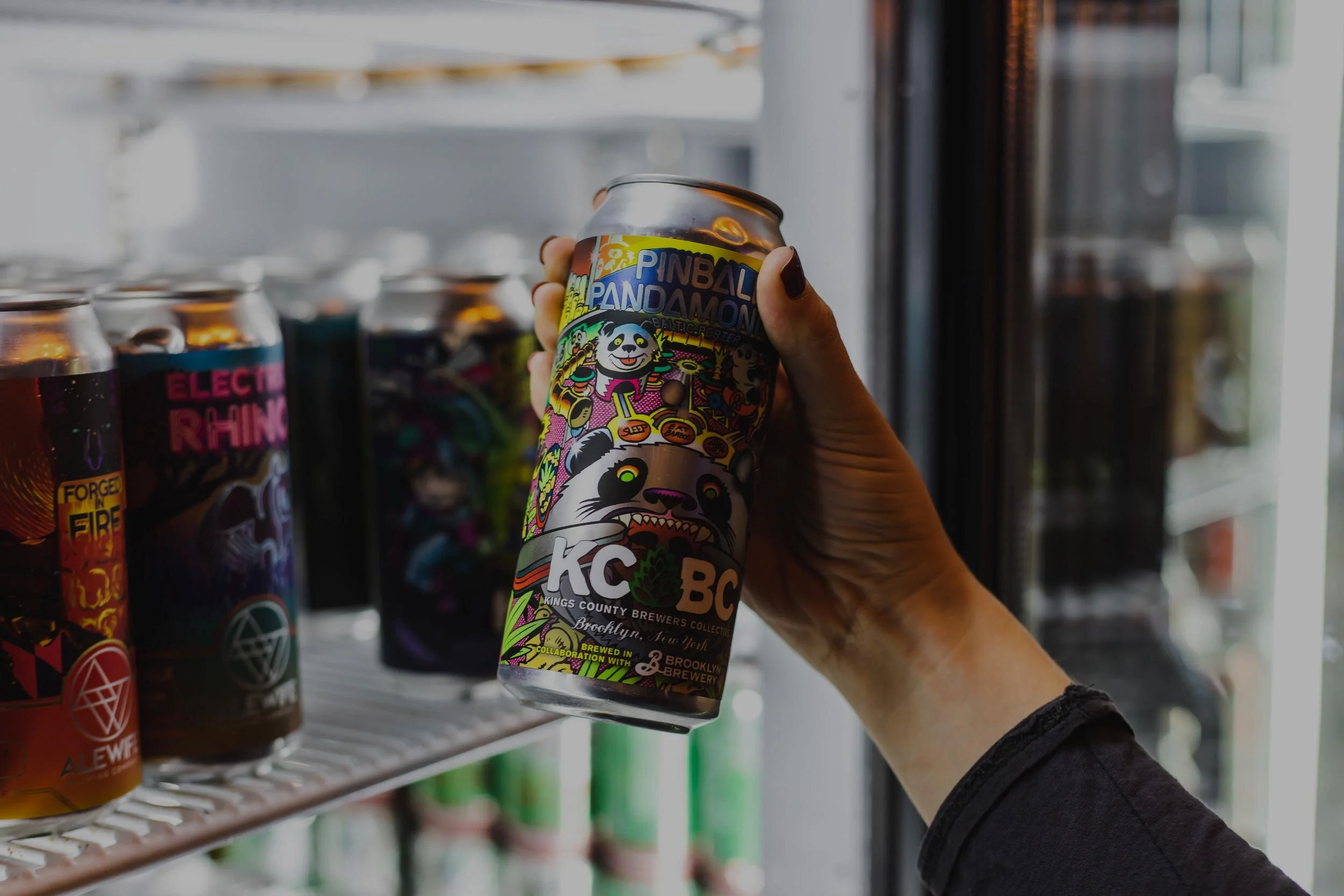 Hand grabbing beer out of cooler.jpg