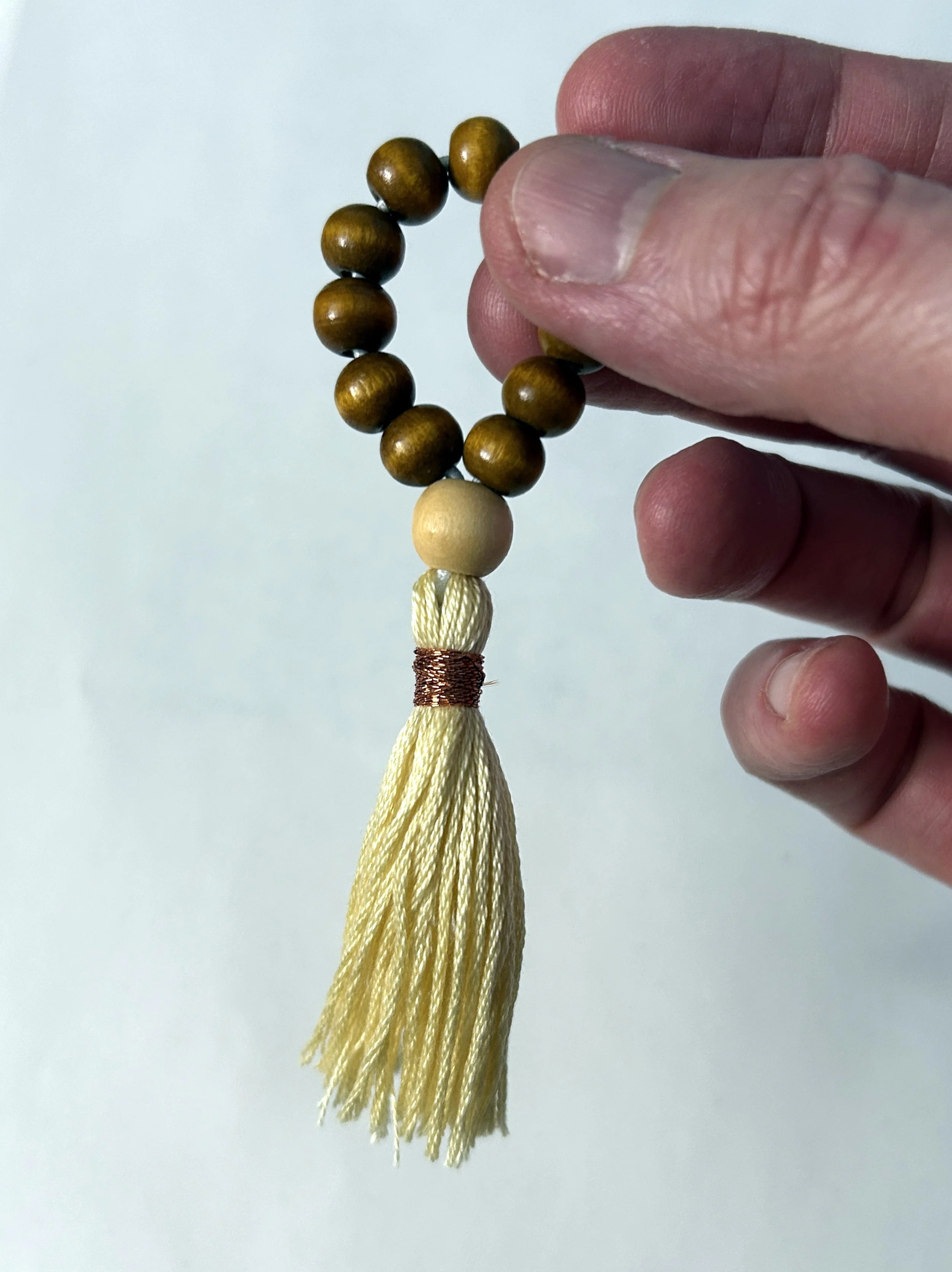 using finger mala with thumb and finger tips