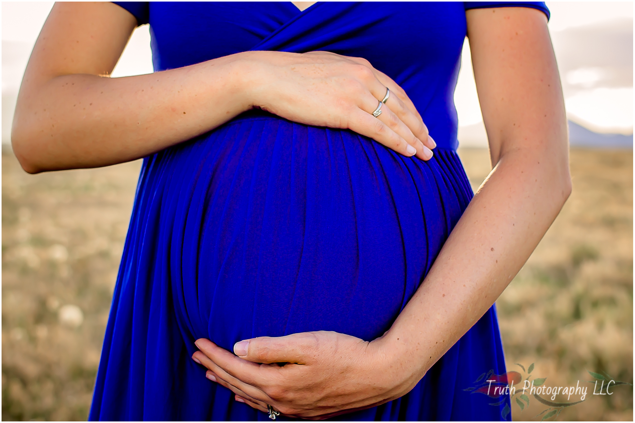 Mom cradling baby bump