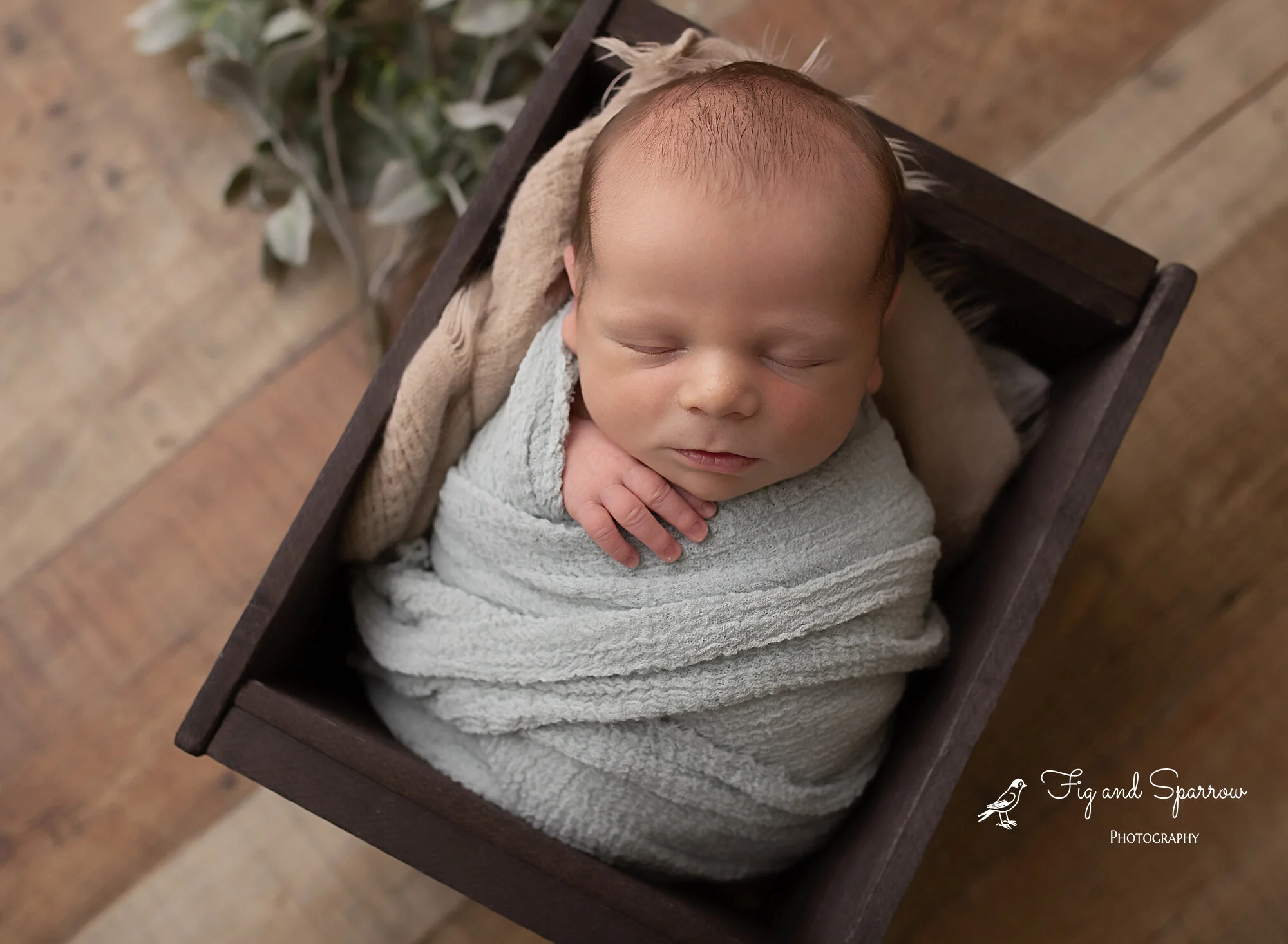 Light-blue-swaddle-on-wood-floor.jpg