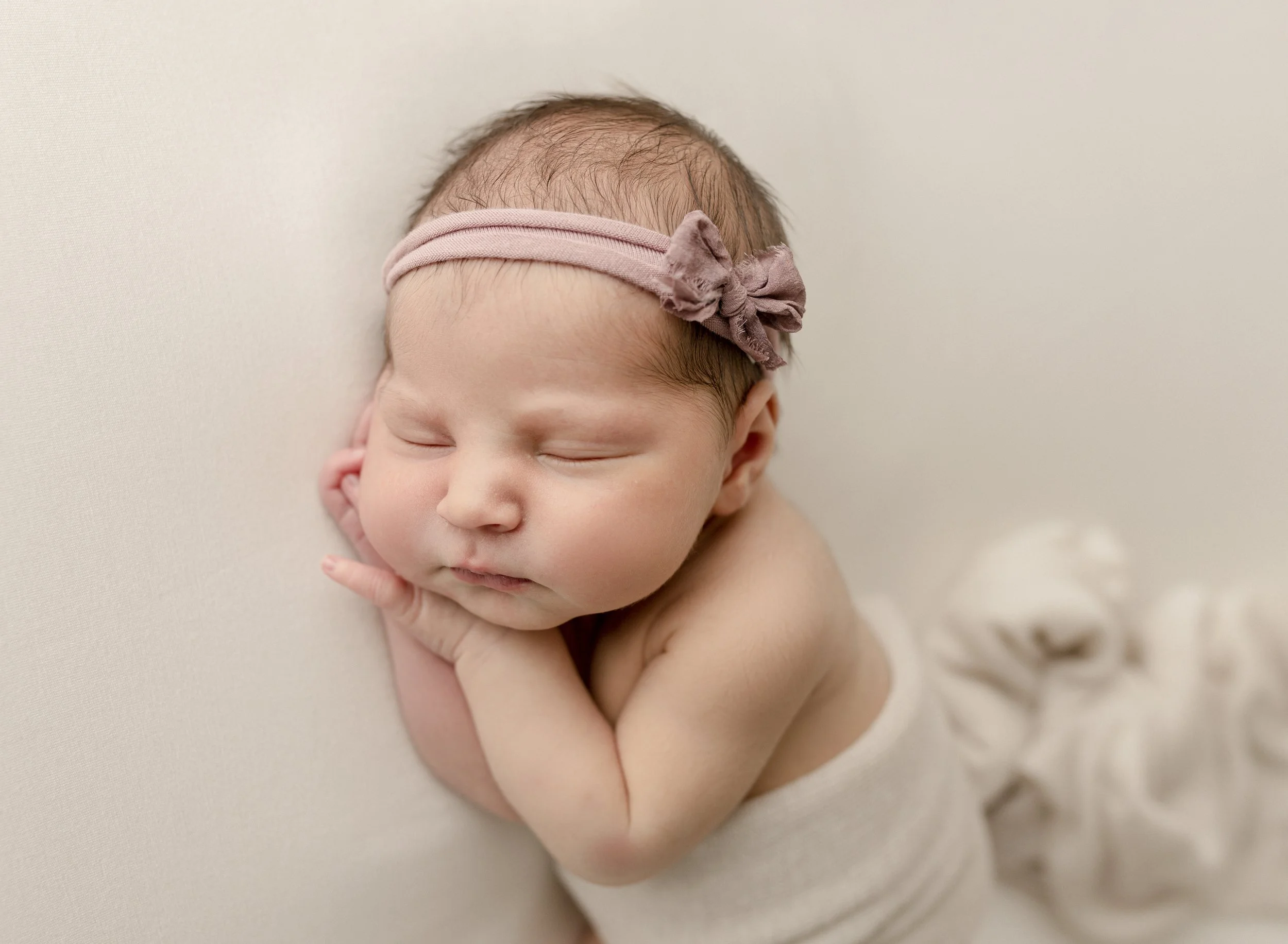 baby-sleeping-with-bow-headband.jpg