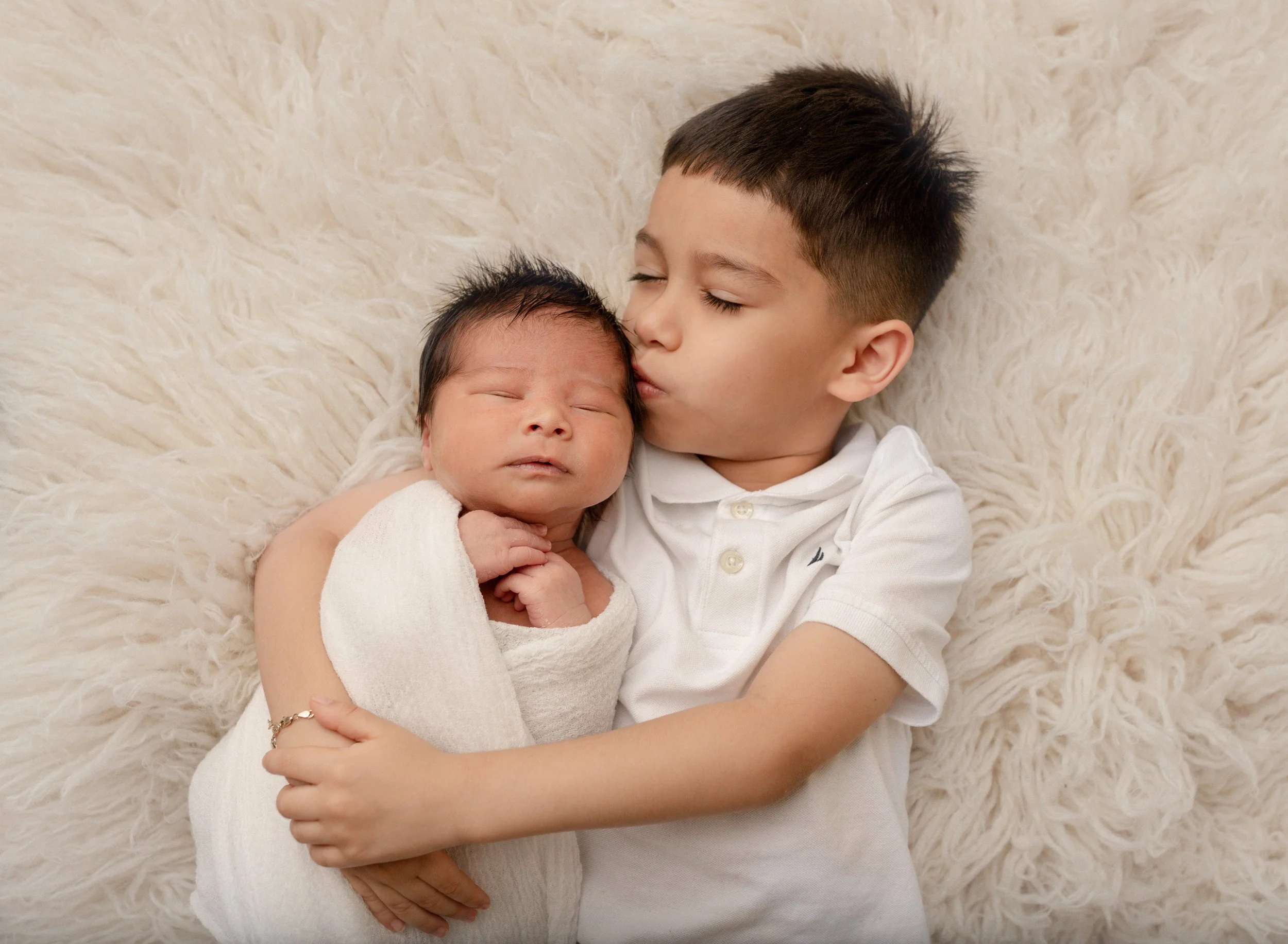 sibling-kissing-baby-brother's-head.jpg