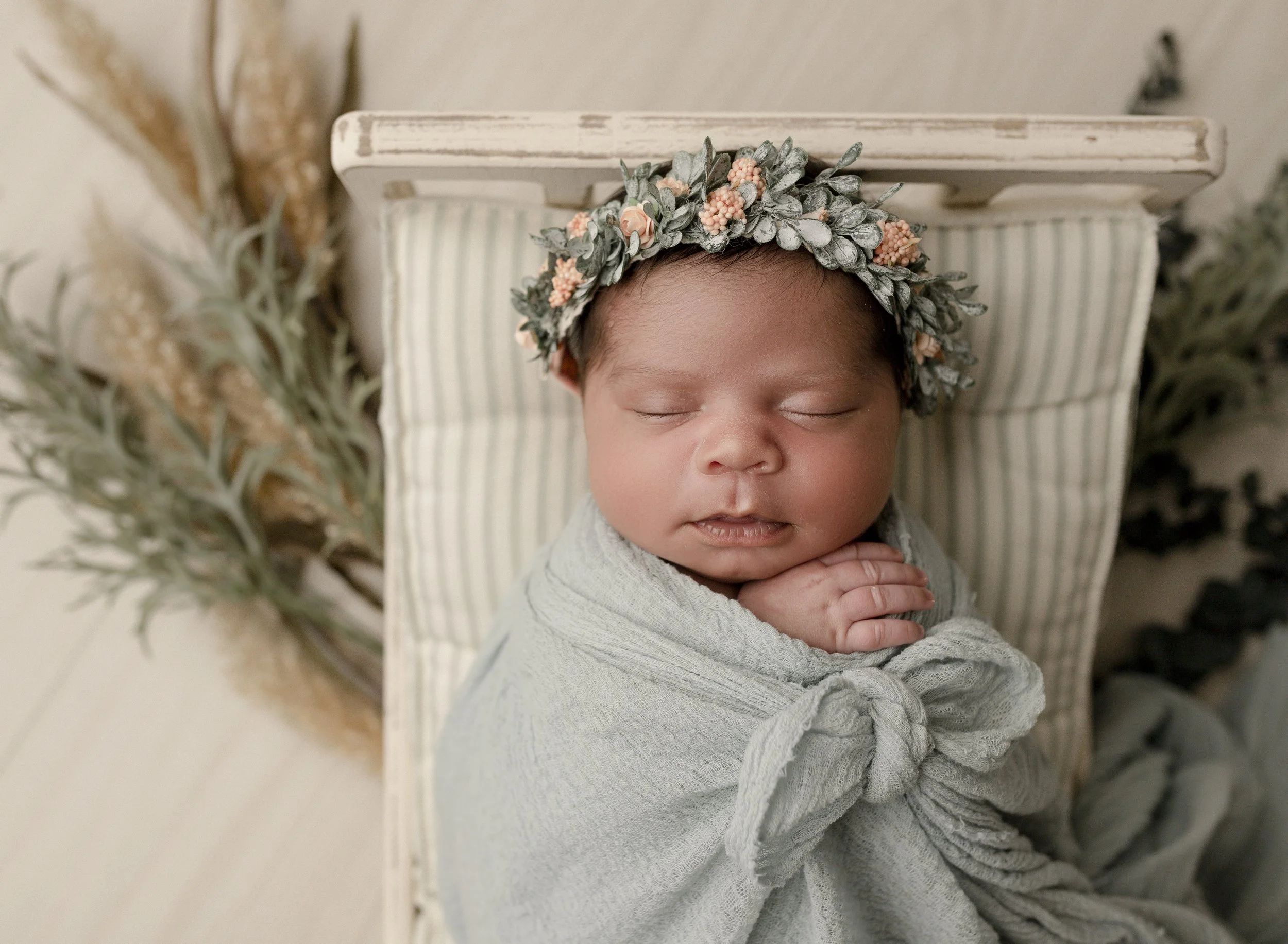 bow-tie-swaddled-newborn-with-florals.jpg