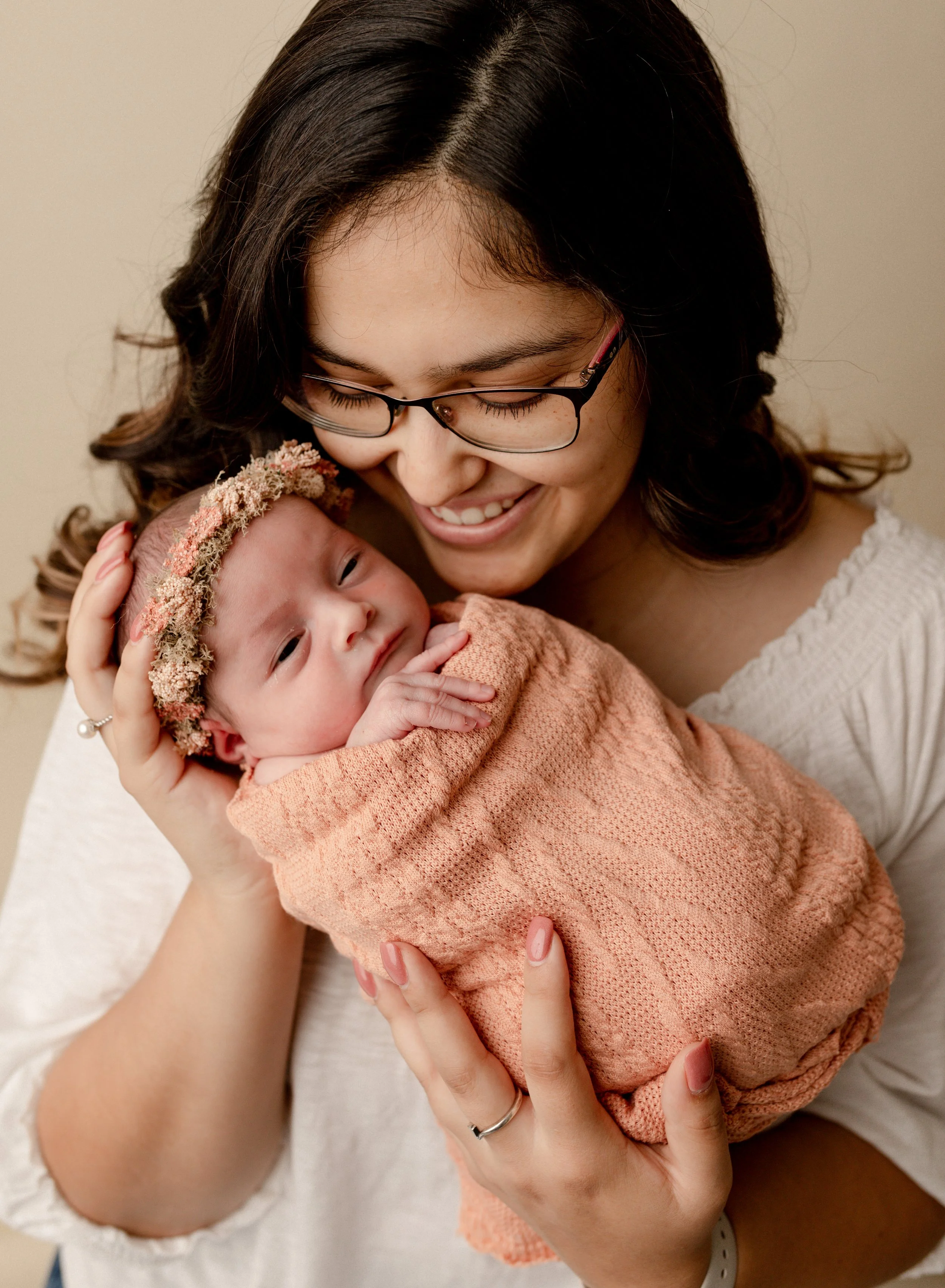 smiling-mother-with-newborn-daughter.jpg