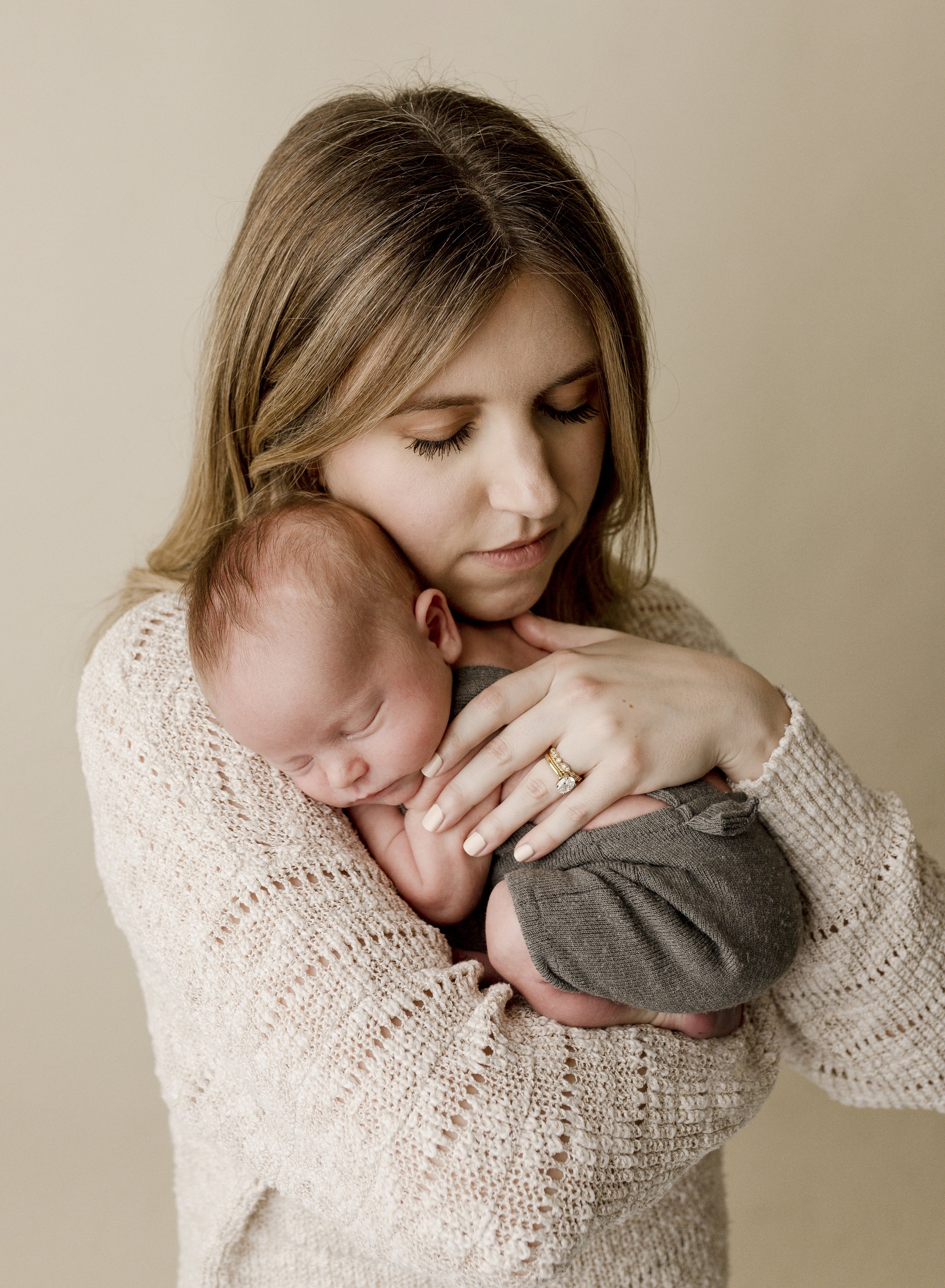 Mother-snuggling-newborn.jpg