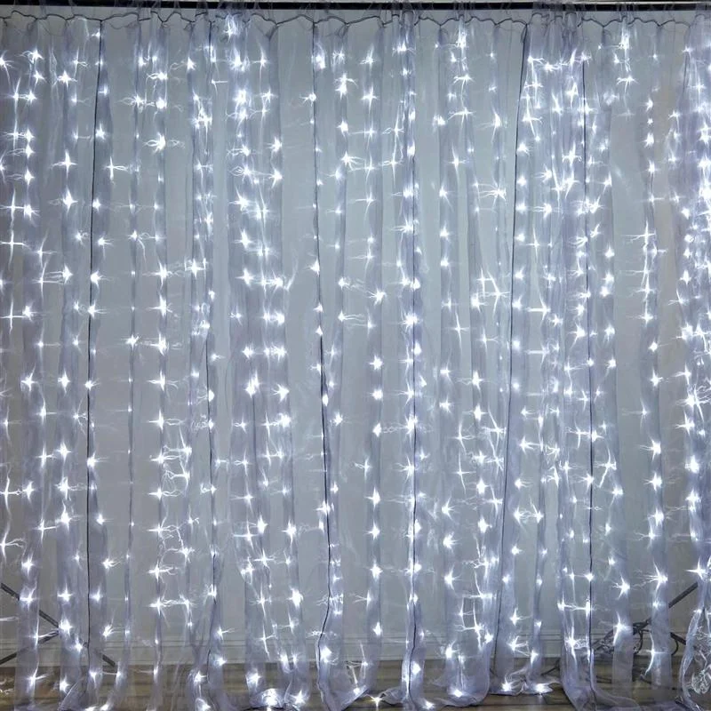 Curtain of lights. 20 W x 10 H white organza curtain backdrop with white LED lights.jpg