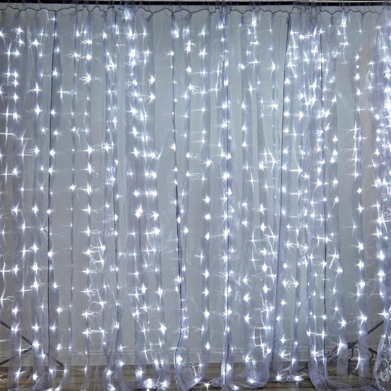 Curtain of lights. 20 W x 10 H white organza curtain backdrop with white LED lights.jpg