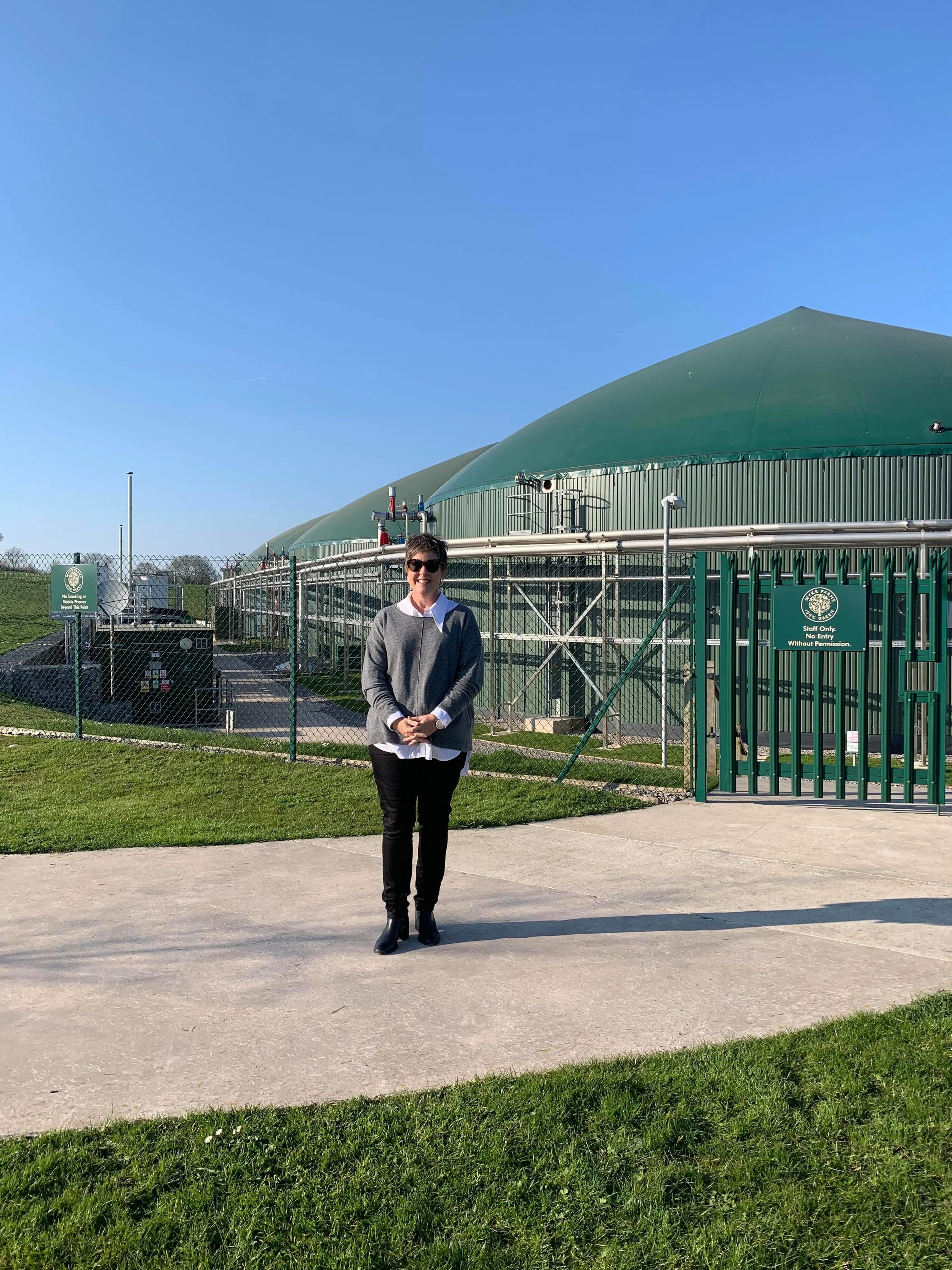 Allison Clark outside Wyke Farms Sustainable Energy Centre in England.