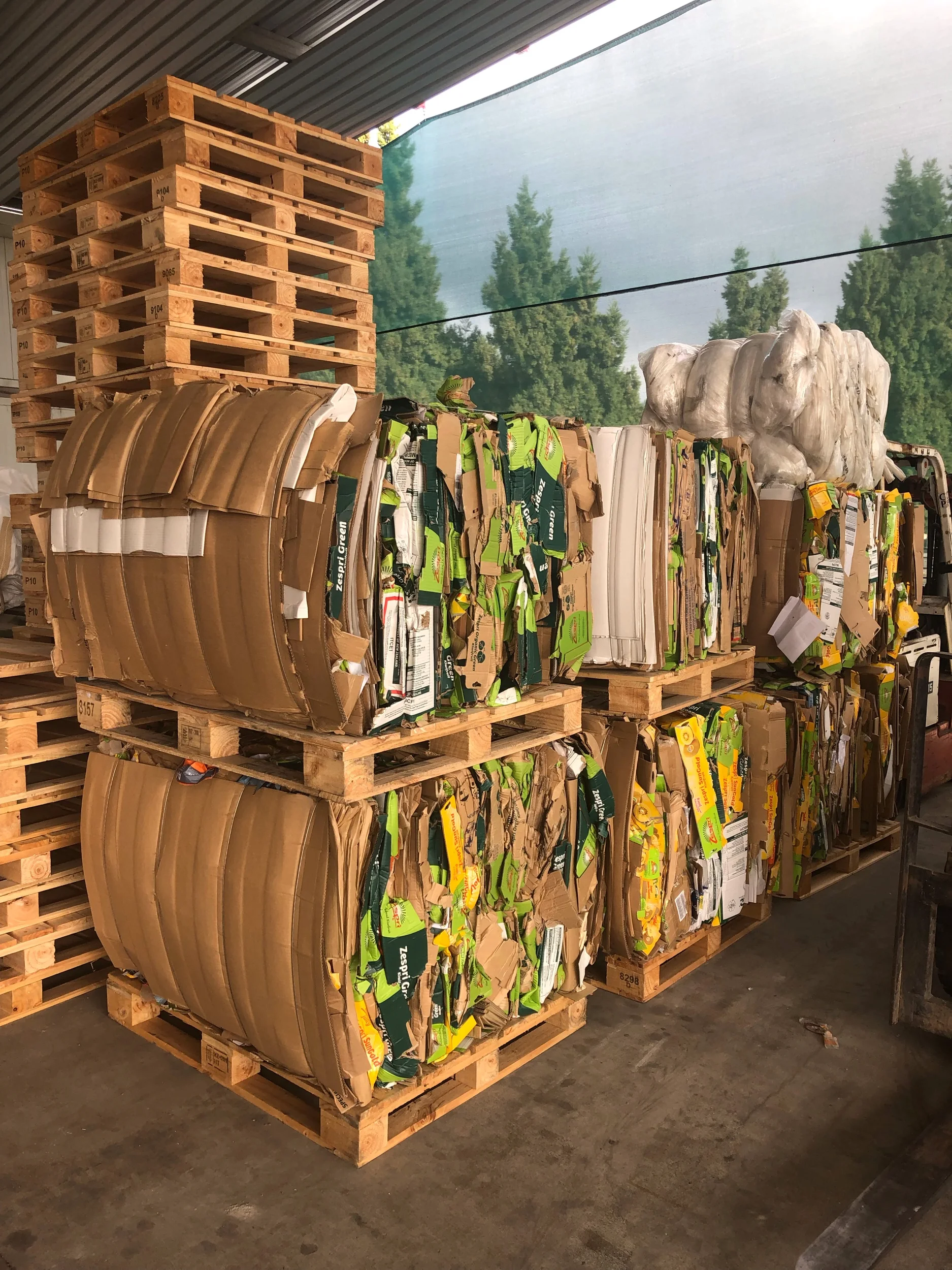Cardboard material is baled and sold to a recycler. 