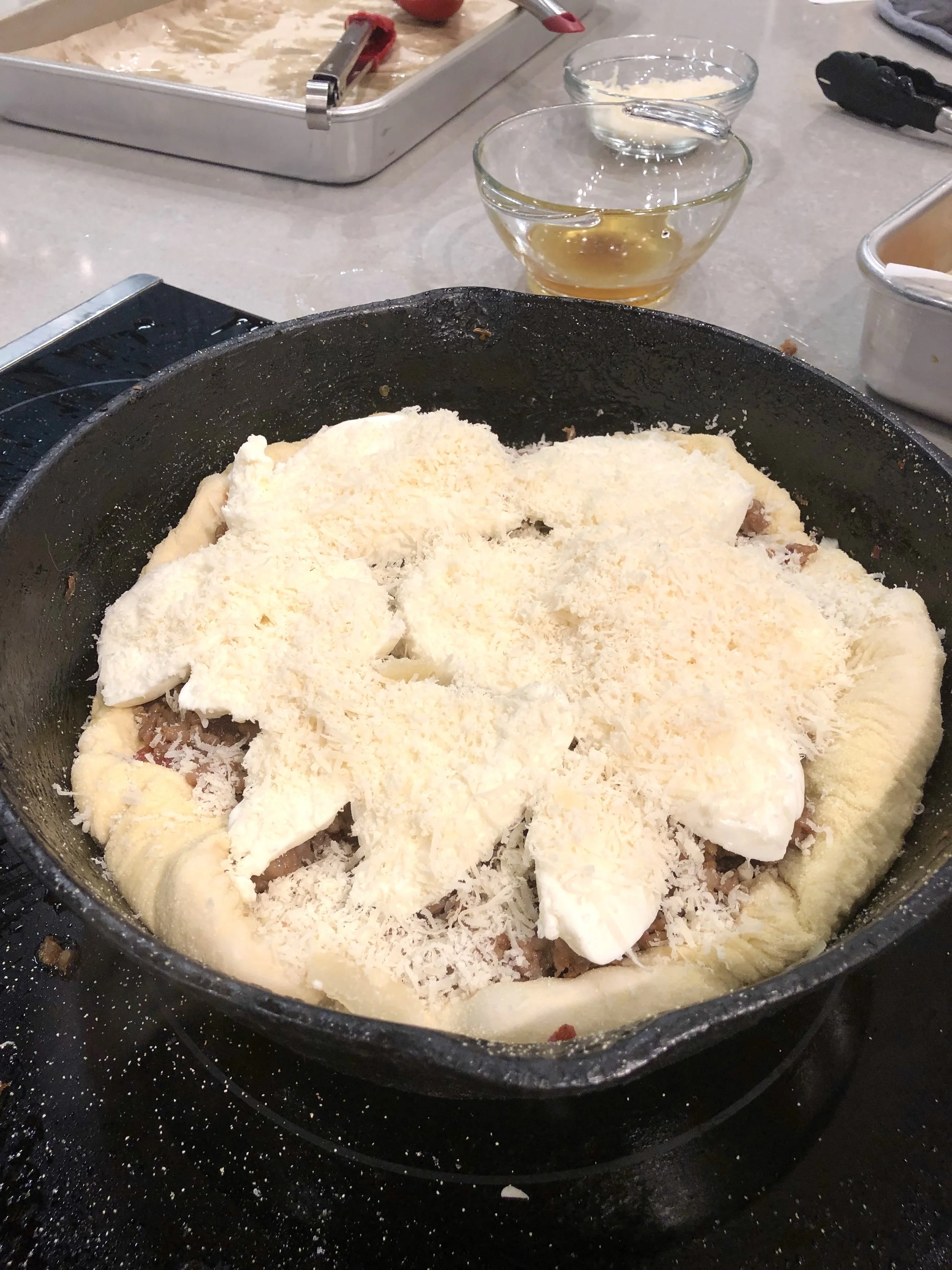 Pizza assembled and ready for oven.