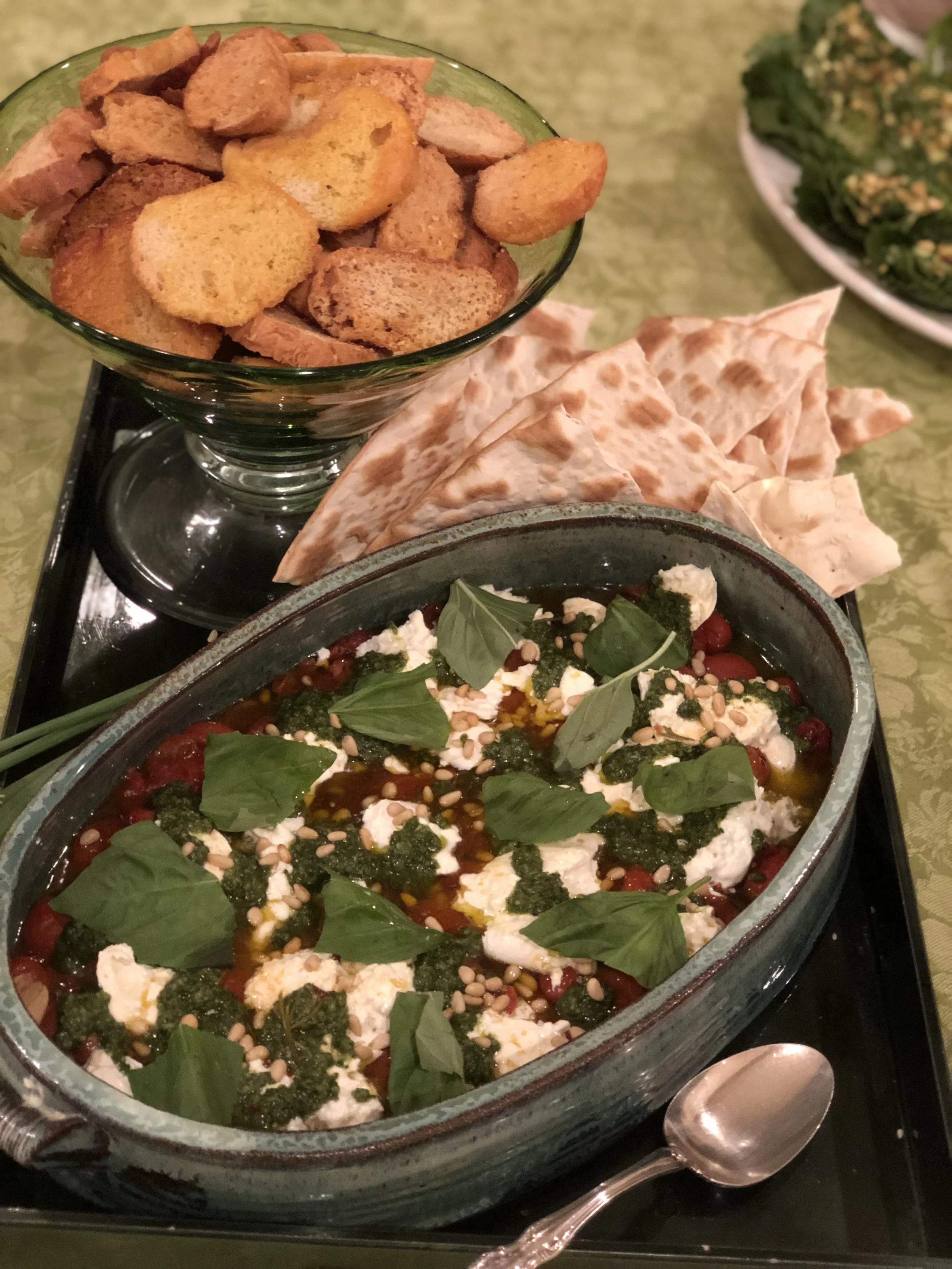 Jammy tomatoes, homemade pesto, and fresh burrata