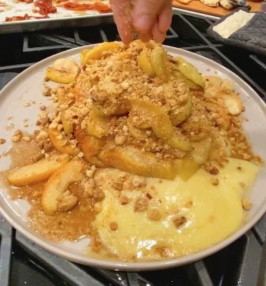 Pastry Wrapped Baked Brie with Maple Butter Roasted Apples and Pistachio Crumble 