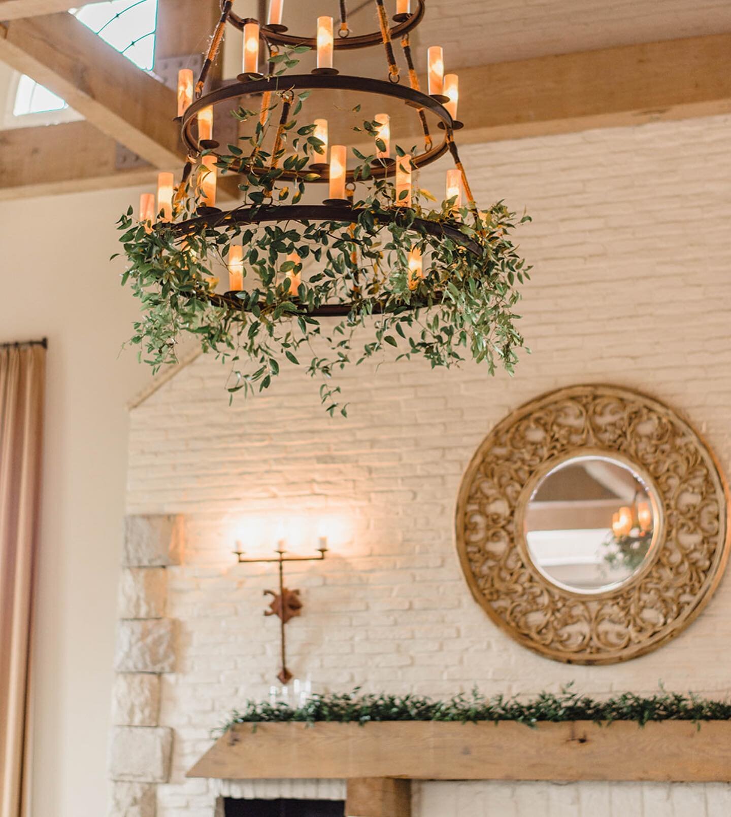 Looking to add impact + wow your guests without breaking the bank? Consider adding greenery to the chandeliers, string lights, or poles in your reception space. We have heard guest describe it as &ldquo;we felt like we were dancing underneath a roman