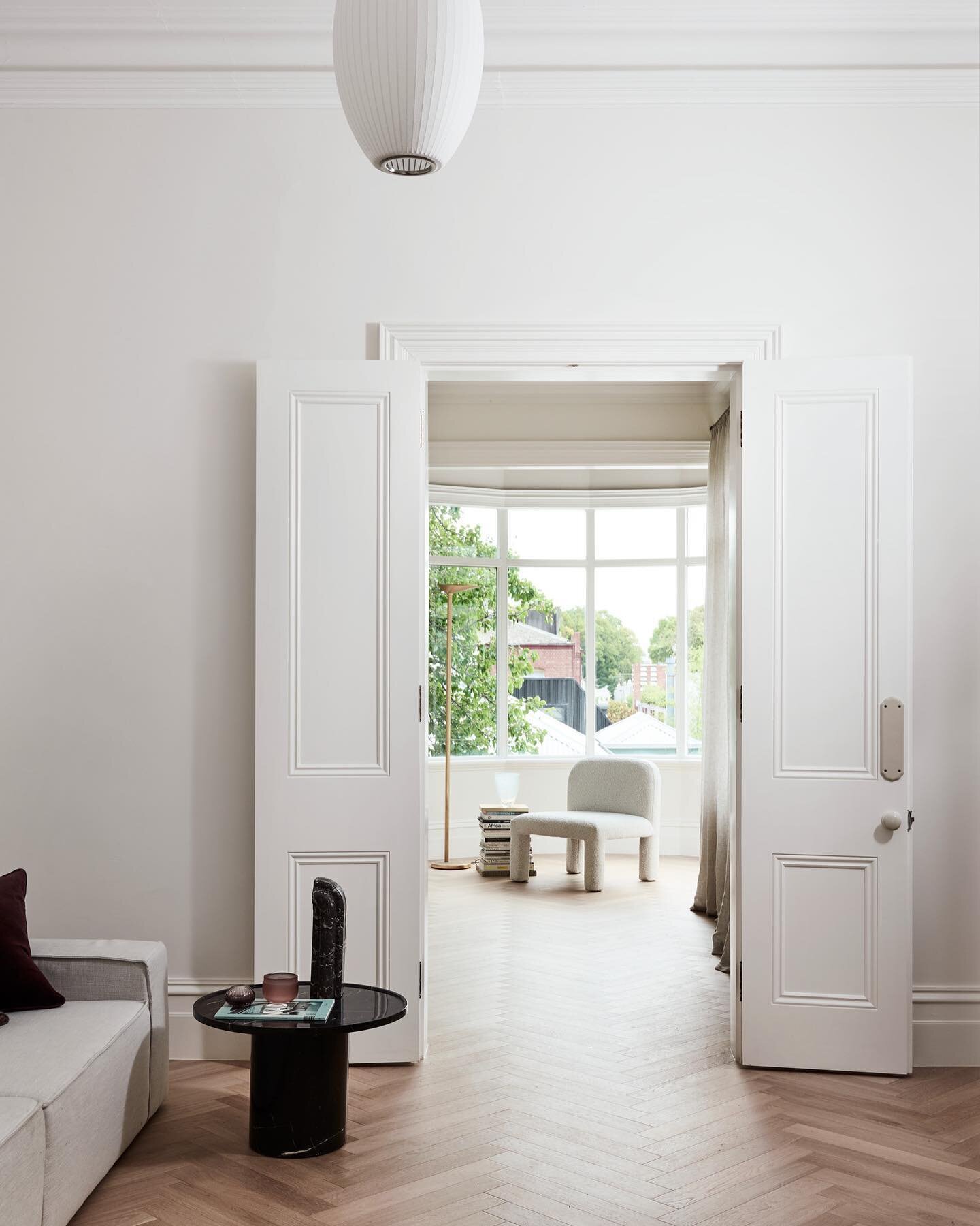 At One Wolf Design we love to honour the history and soul of a heritage home. This living room at #BremenCottage was updated through the use of a modern palette, finished and fixtures whilst preserving details such as the enamel door hardware and res