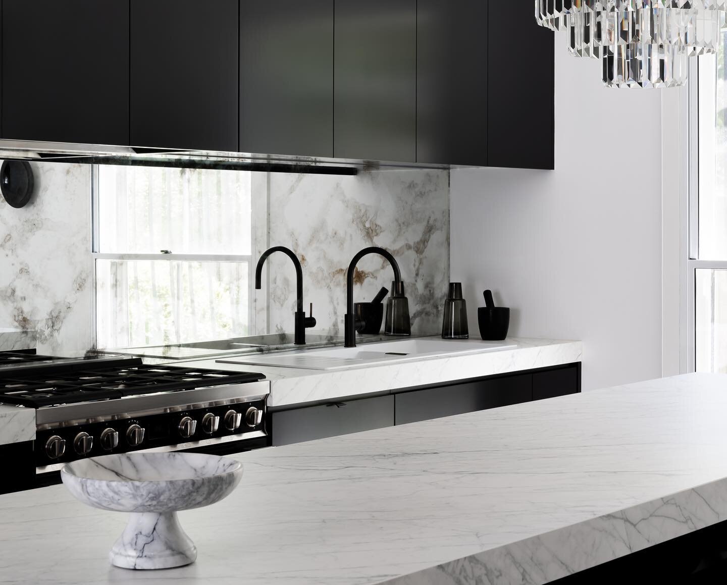 Custom antique aged mirror splashbacks were used at #RupertsResidence. Each piece was oxidised interstate and made to fit seamlessly in place. This unique design element was introduced to help reflect light and create depth, whilst working with the a