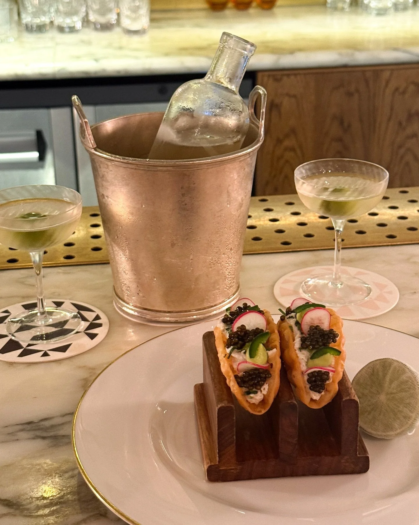 Raw Cornish fish and caviar tacos at the bar, paired with the Martini 45 for two - Hepple Gin, Noilly Prat Dry and Palo Cortado.