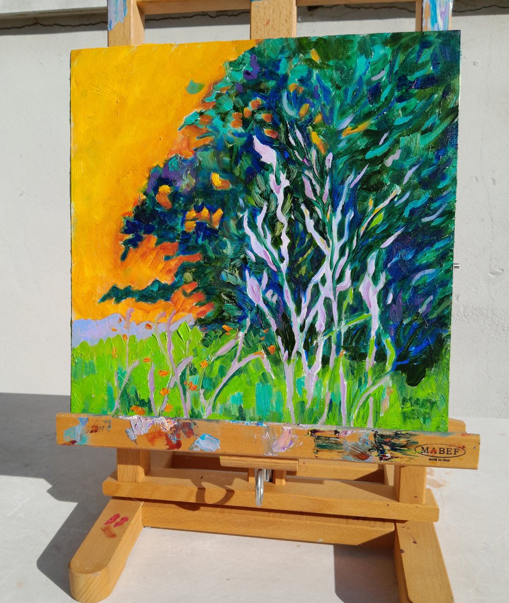 Mary Kemp Trees Orange and Blue on easel.jpg