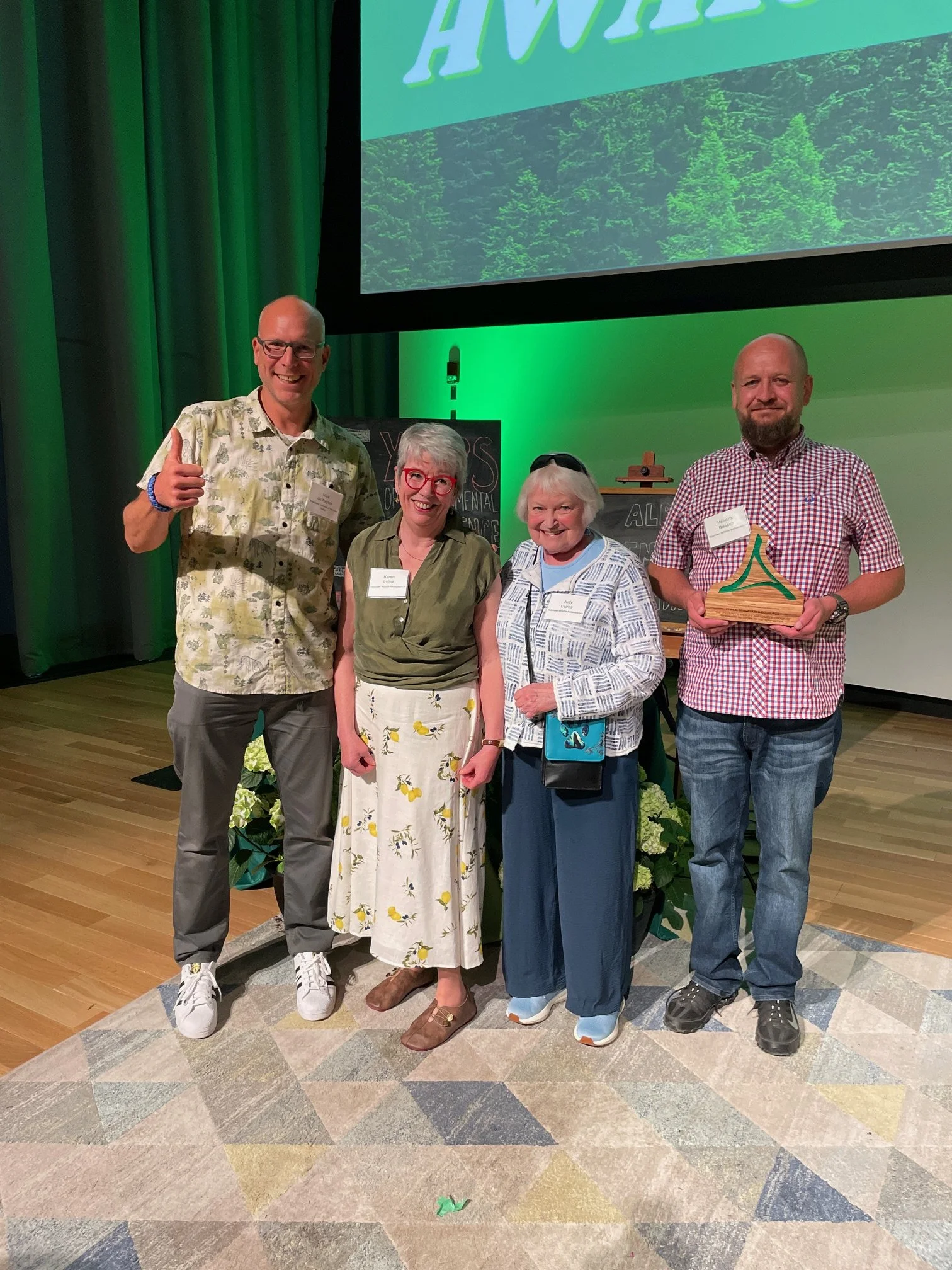  Posing with the Emerald Award from L to R: Nick (Biosphere staff) and Wildlife Ambassadors Karen, Judy and Hendrik. 
