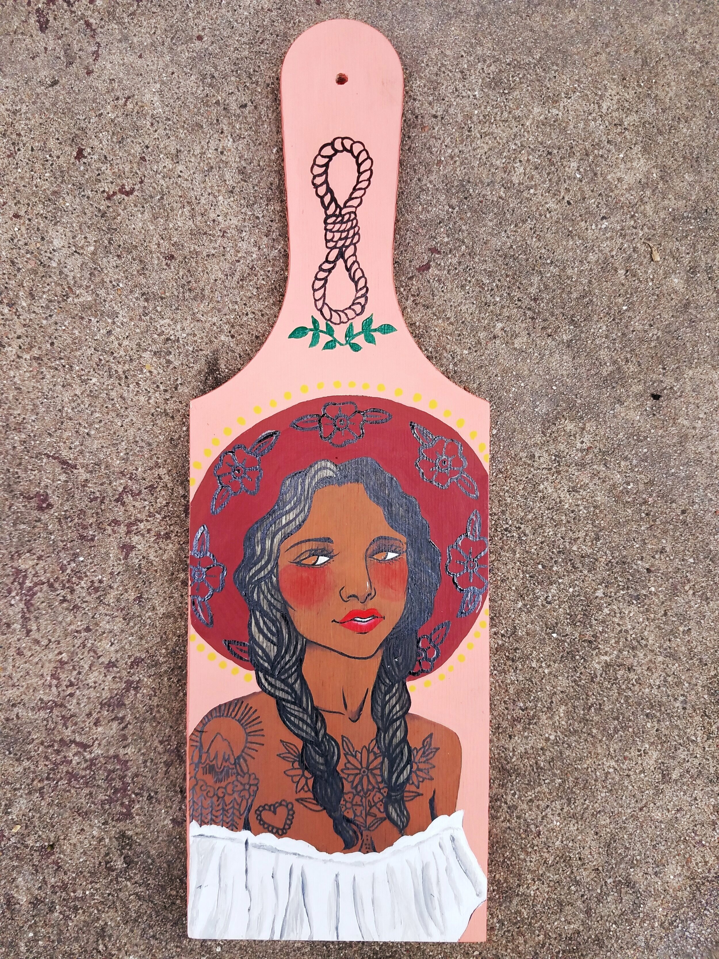 Acrylic paint and ink on wood paddle. 