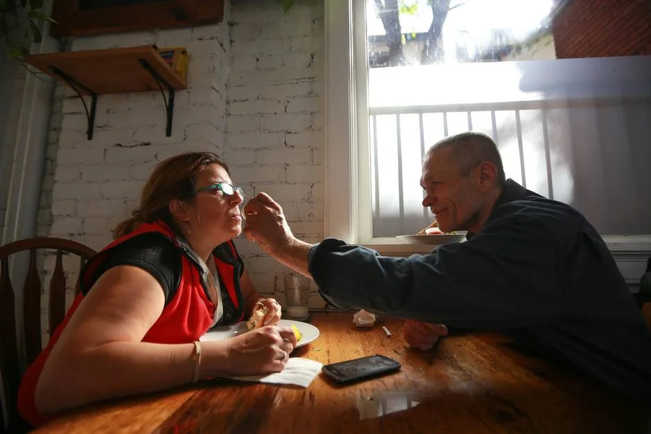 Terry Barron wipes the lips of his friend Joanne Doucet in 541.