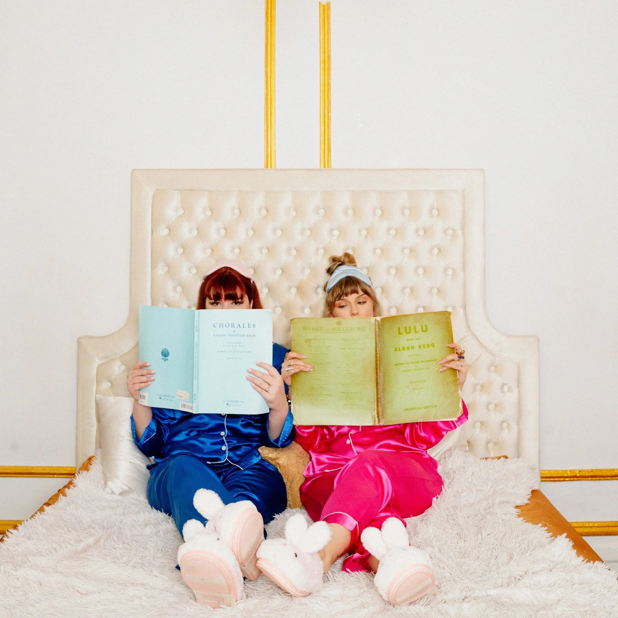 Britt Hewitt and Emily Duncan read two classical scores while lounging in bed.