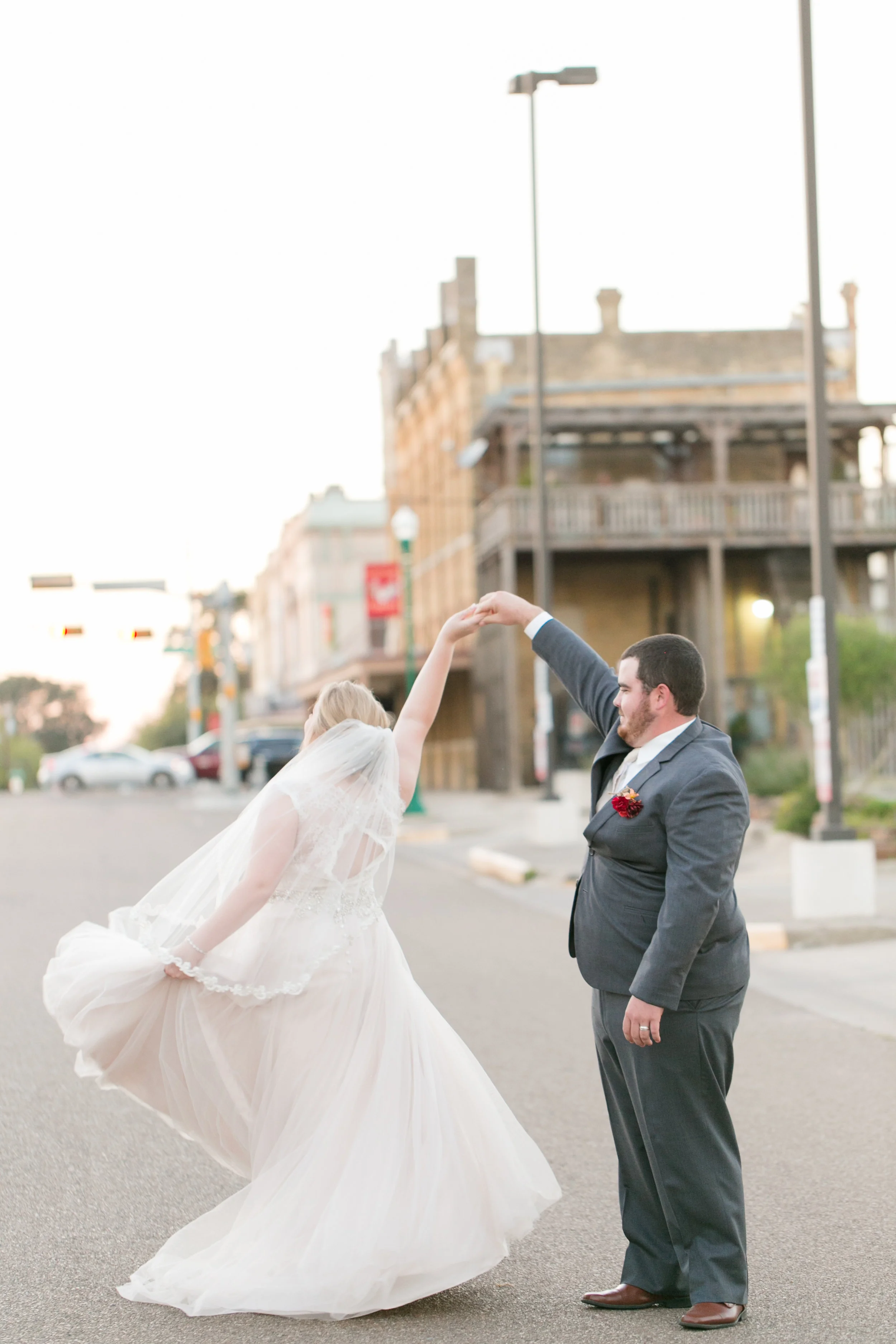 Bride and groom dance in the street