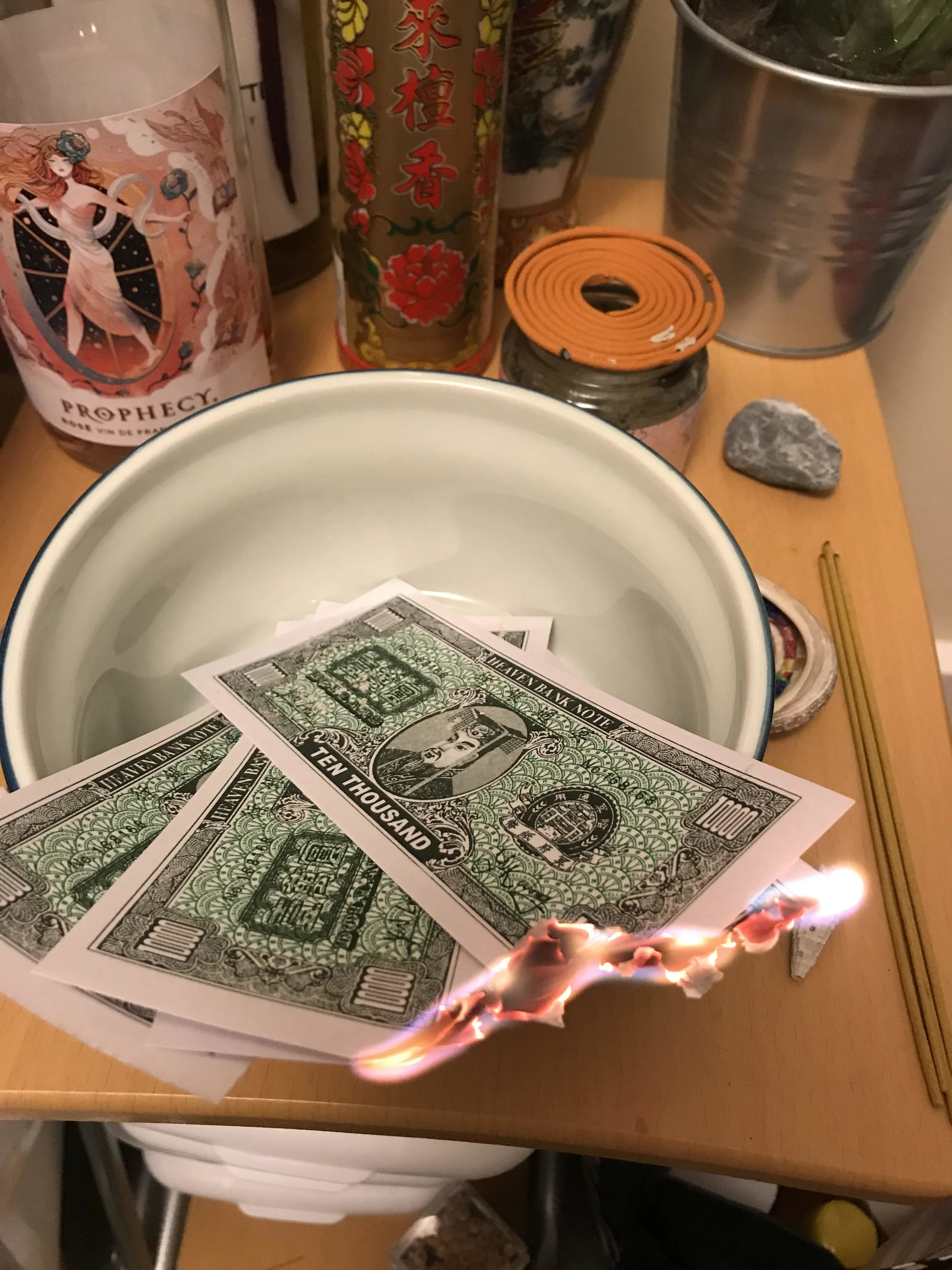 Burning hell money to recognize my ancestors.